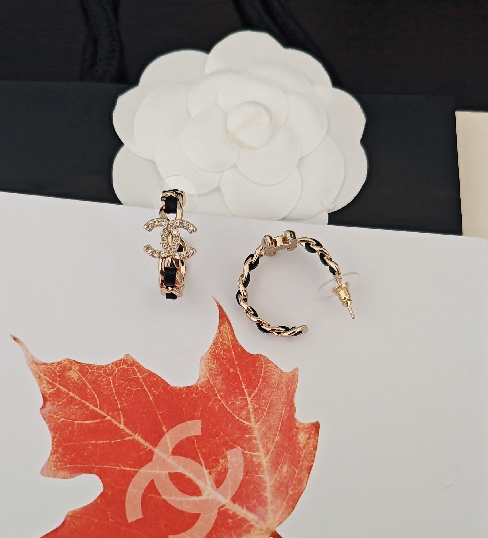 Signature Emblem Jewelry Accessory in Gold-Tone – Black Detail front product view