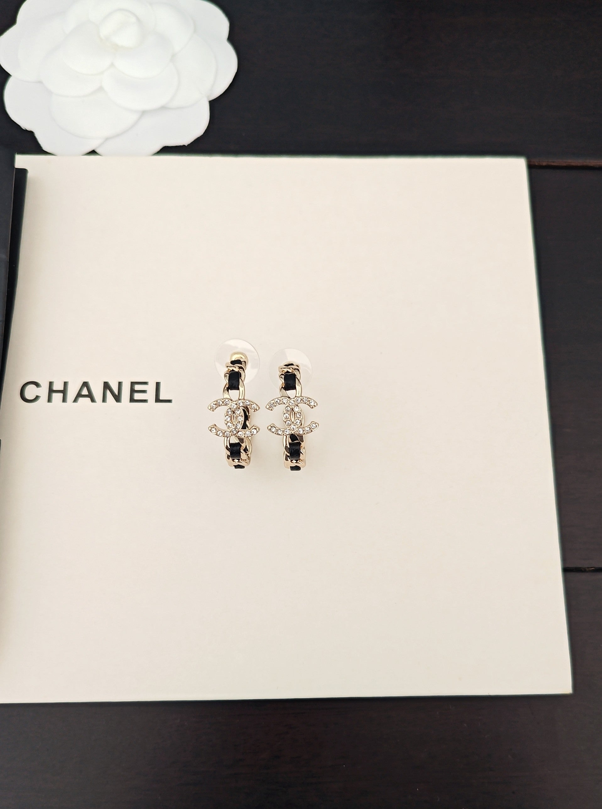 Signature Emblem Jewelry Accessory in Gold-Tone – Black Detail close-up detail
