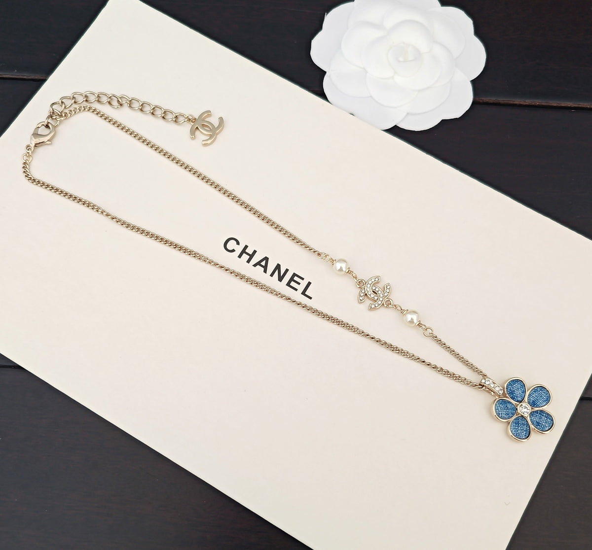 Signature Emblem Crystal-Accent Pendant Necklace – Blue Detail close-up detail