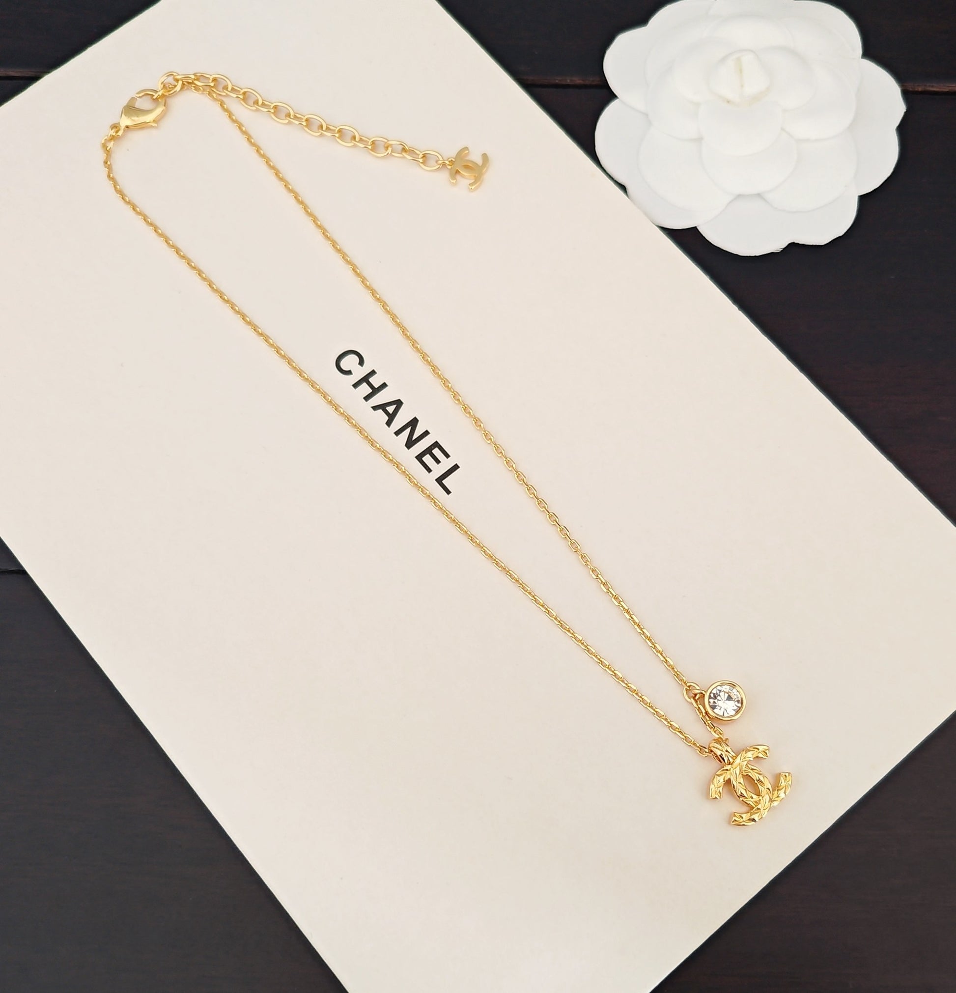 Signature Emblem Crystal-Accent Pendant Necklace – White Detail close-up detail