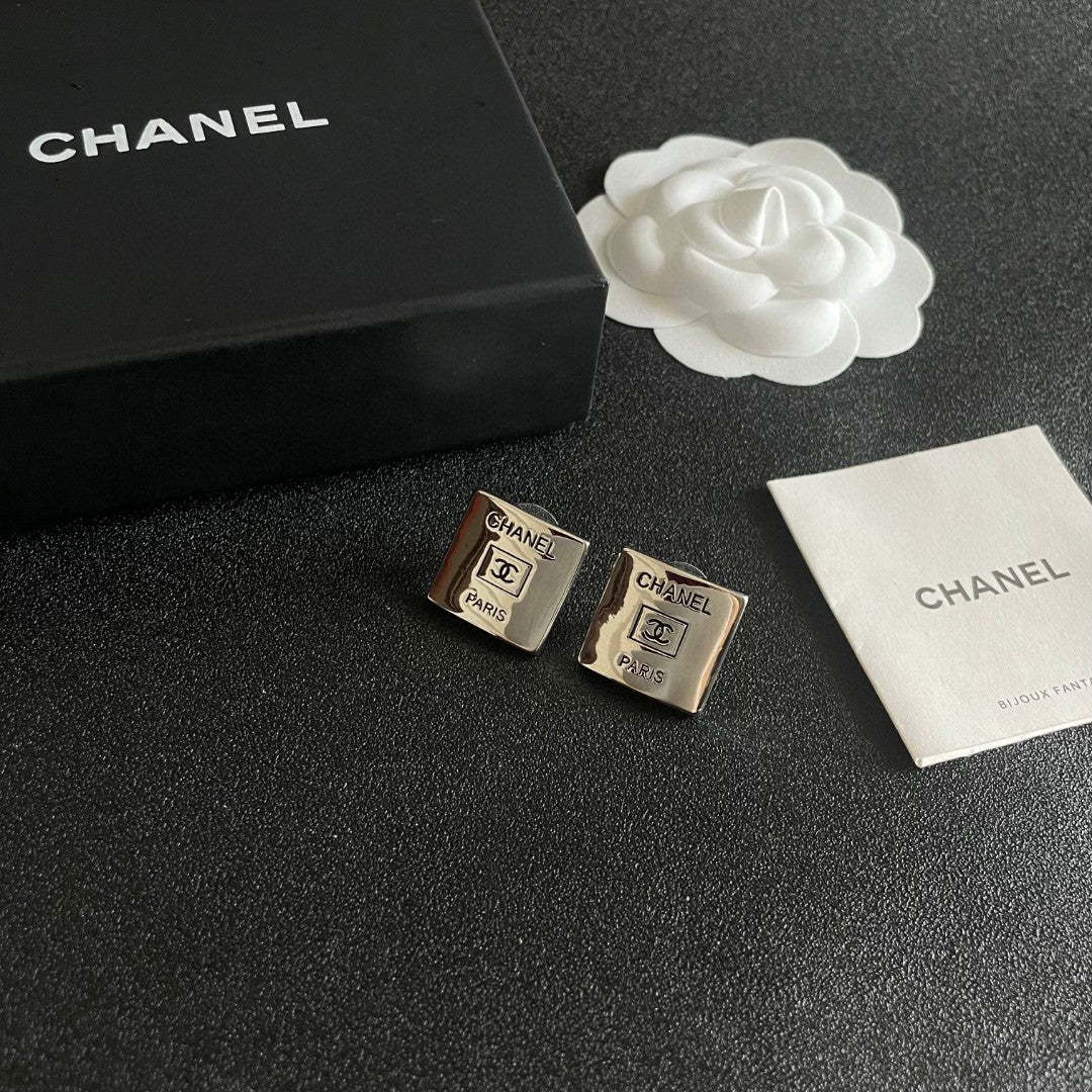 Double-C Emblem Stud Earrings in Polished Metal-Tone – Design 253 styled product view