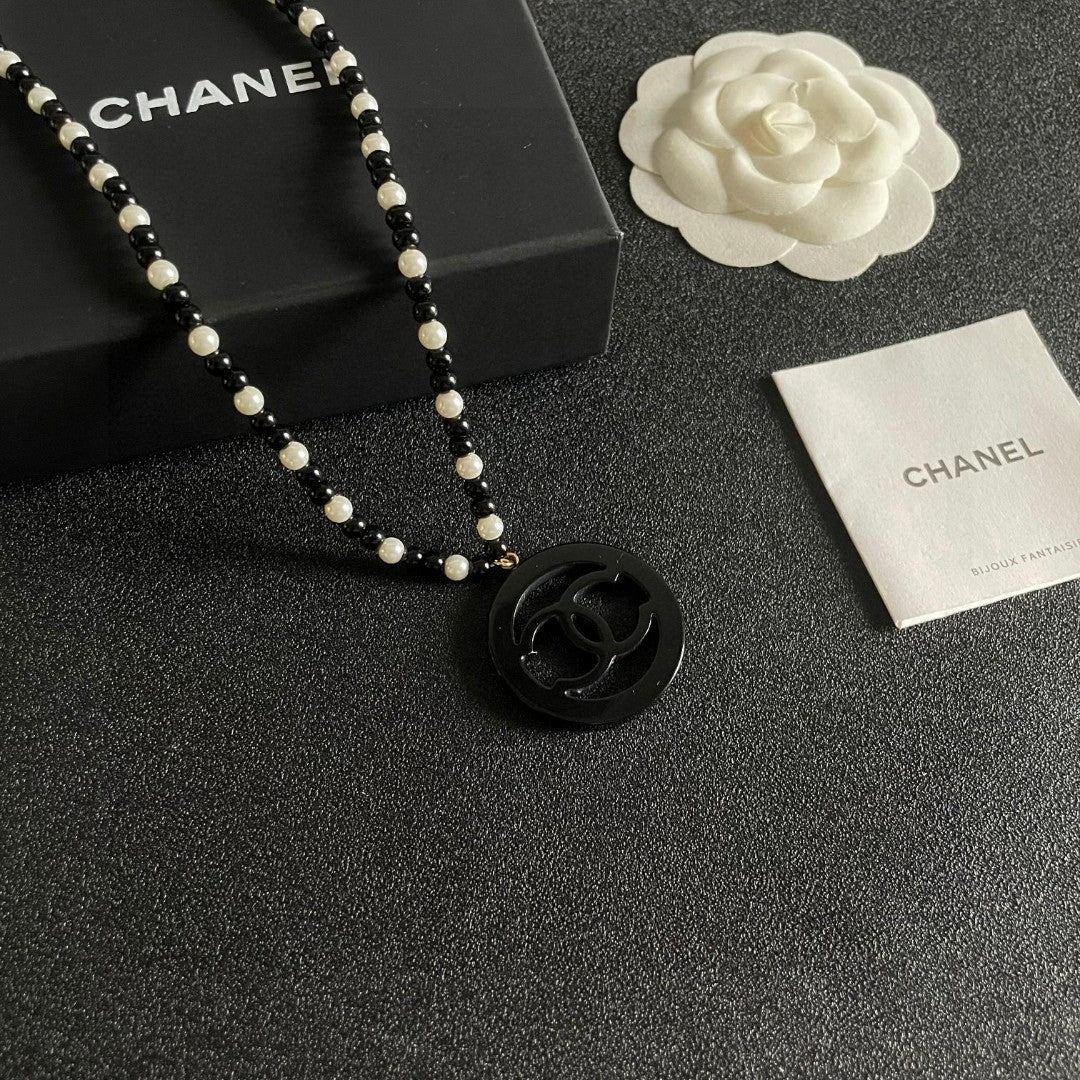 Double-C Emblem Pearl-Detail Pendant Necklace – Pearl Detail – Design 006 styled product view
