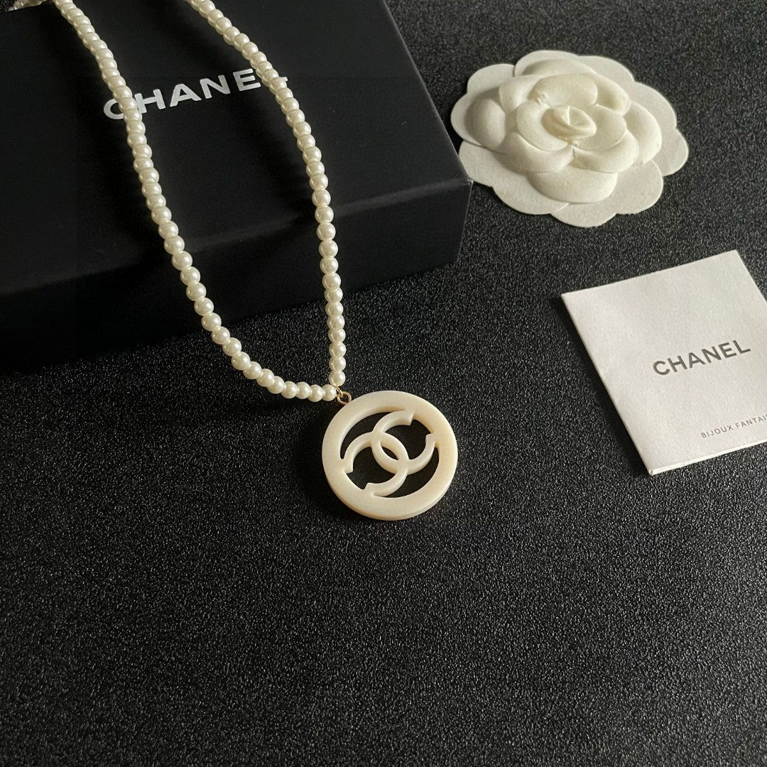 Double-C Emblem Pearl-Detail Pendant Necklace – Pearl Detail – Design 005 styled product view