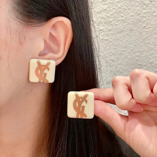 Letter Emblem Stud Earrings in Polished Metal-Tone – Design 004 main product view