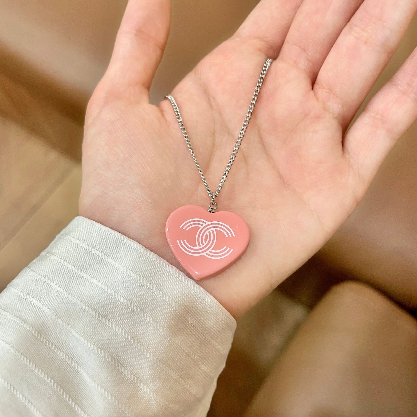 Double-C Emblem Pendant Necklace in Polished Metal-Tone – Heart Detail side detail