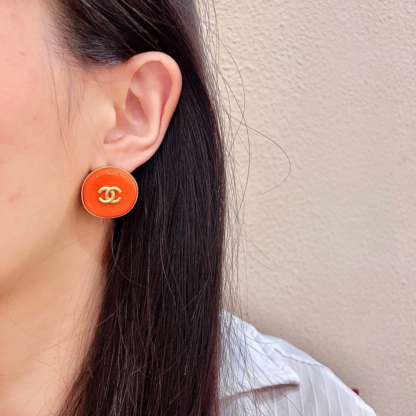 Double-C Emblem Stud Earrings in Polished Metal-Tone – Design 305 detail view
