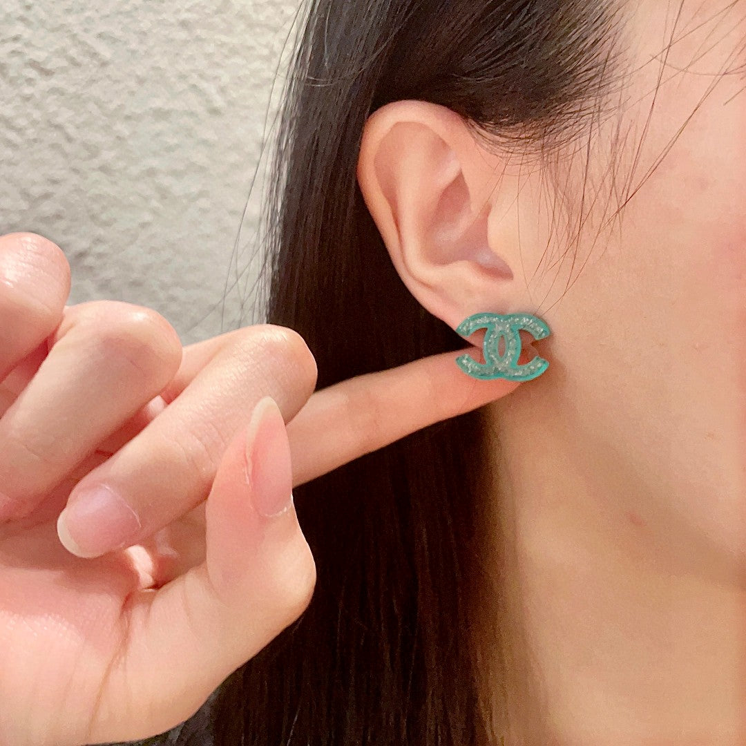 Double-C Emblem Stud Earrings in Polished Metal-Tone – Design 469 front product view