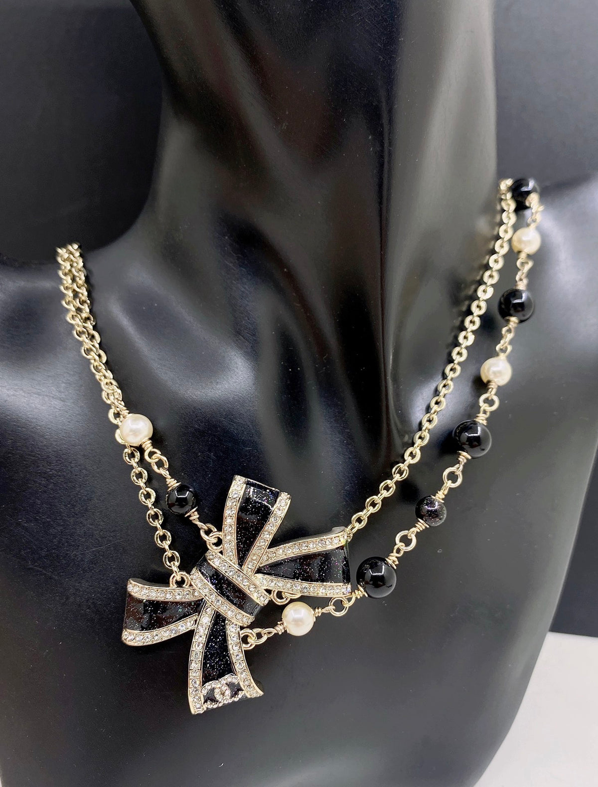 Bow Pendant Necklace in Gold-Tone – Black Detail – Design 003 front product view