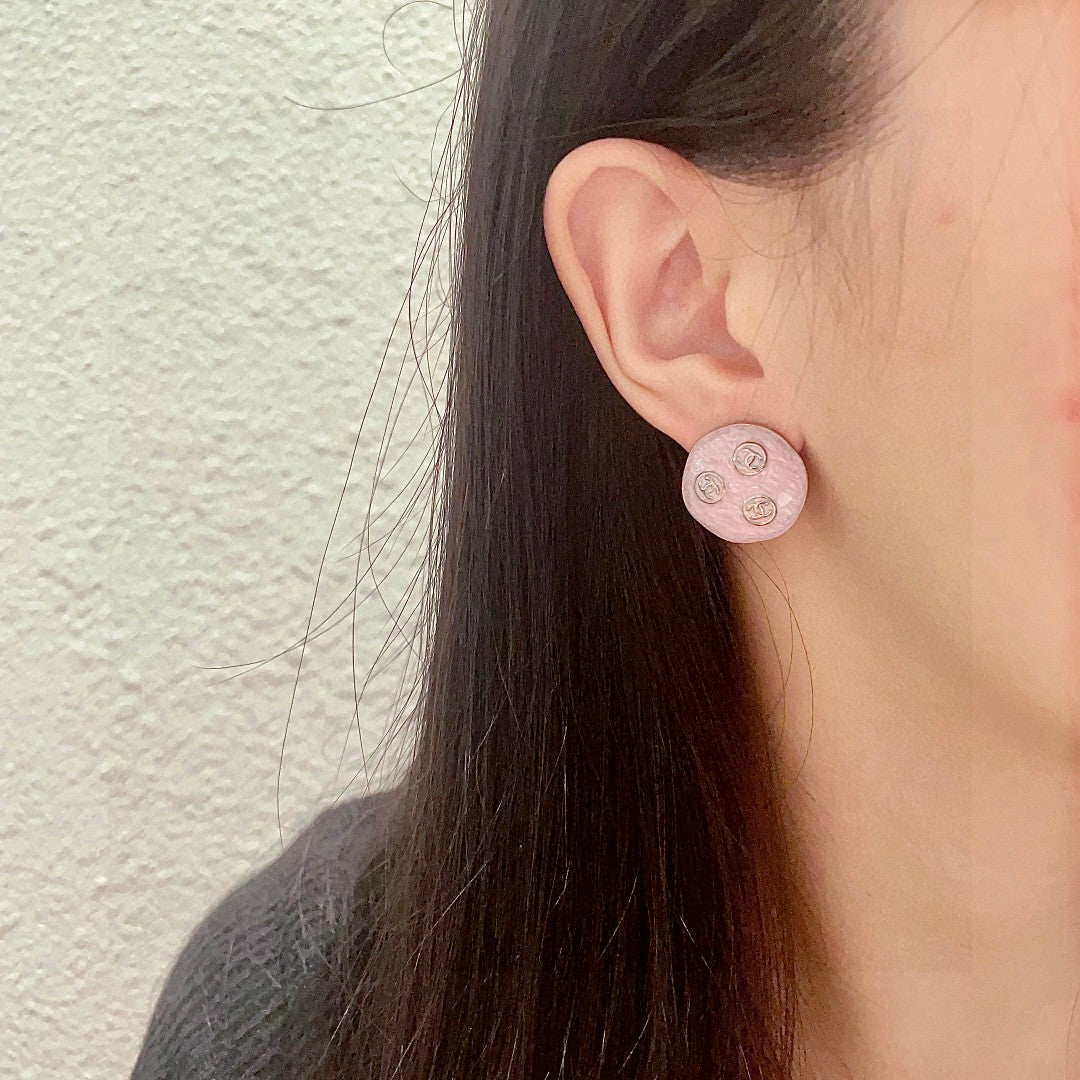 Double-C Emblem Stud Earrings in Polished Metal-Tone – Design 106 detail view