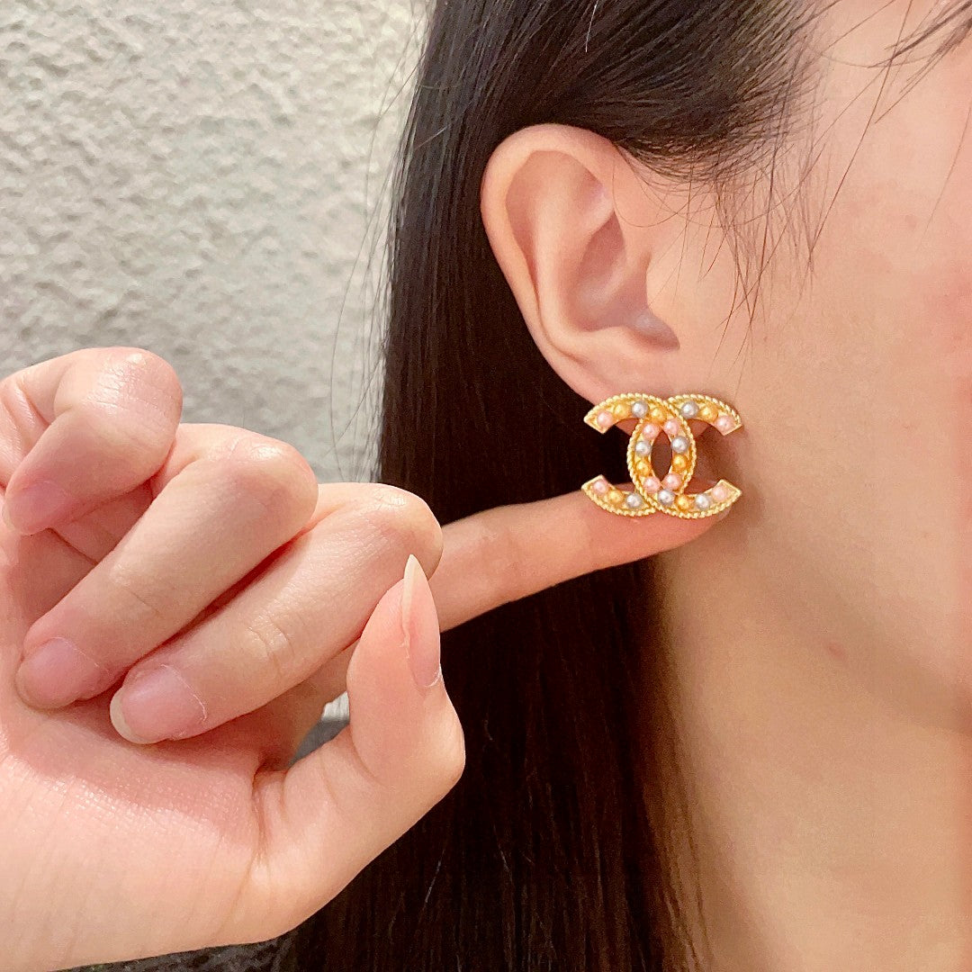 Double-C Emblem Stud Earrings in Polished Metal-Tone – Design 187 front product view