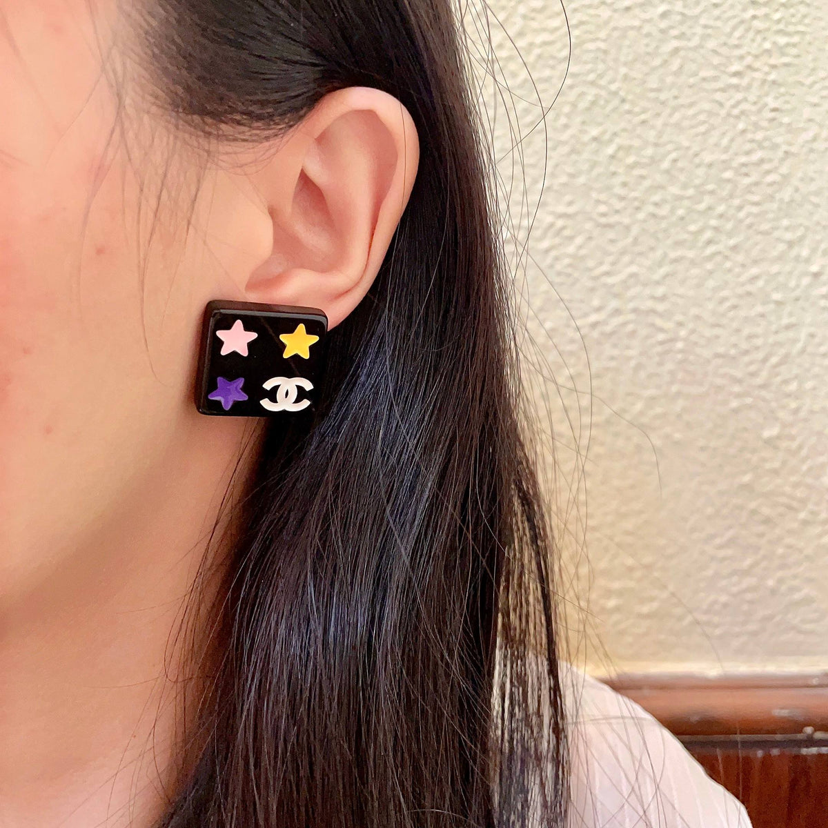 Double-C Emblem Stud Earrings in Polished Metal-Tone – Star Detail – Design 002 detail view