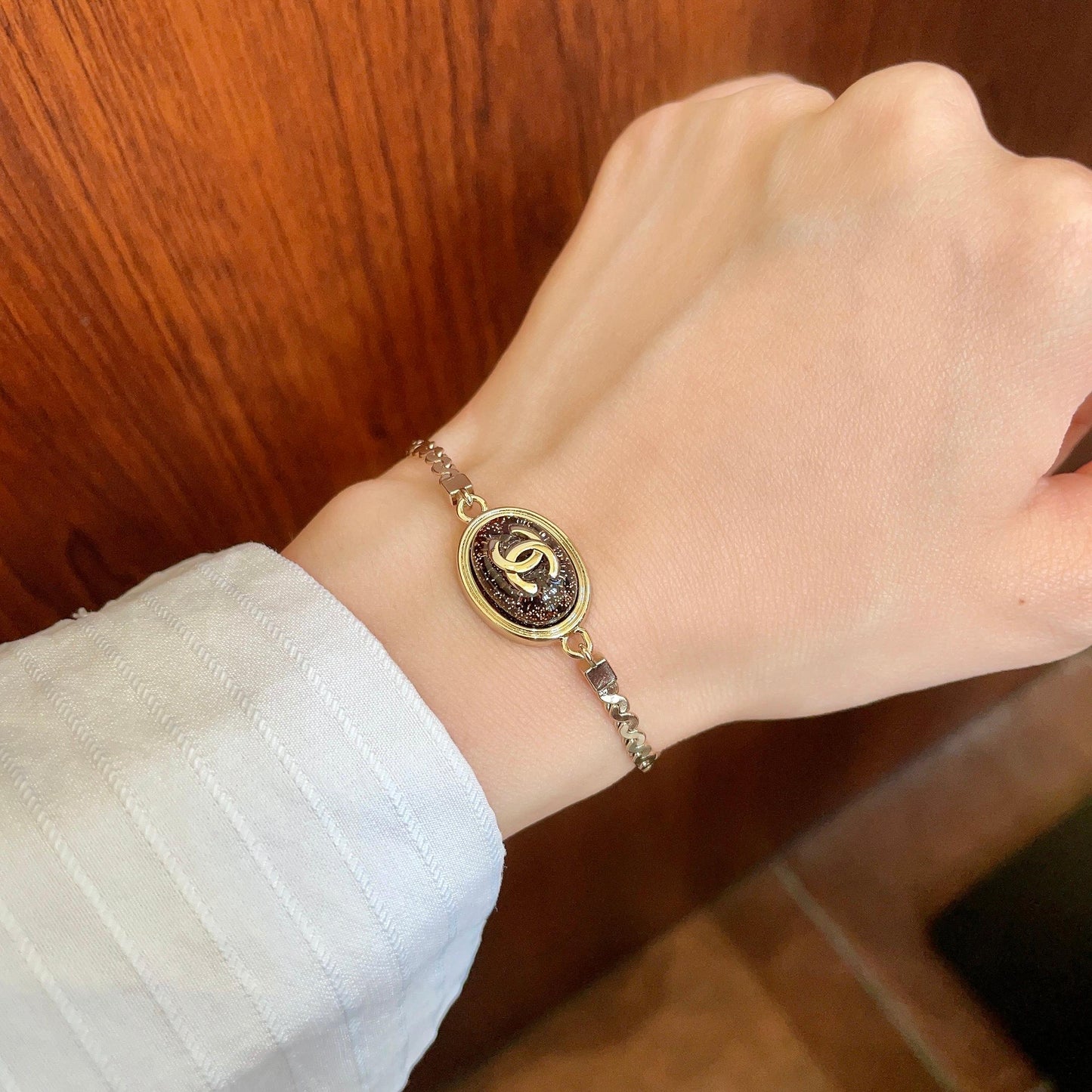 Double-C Emblem Bracelet in Polished Metal-Tone – Design 001 front product view