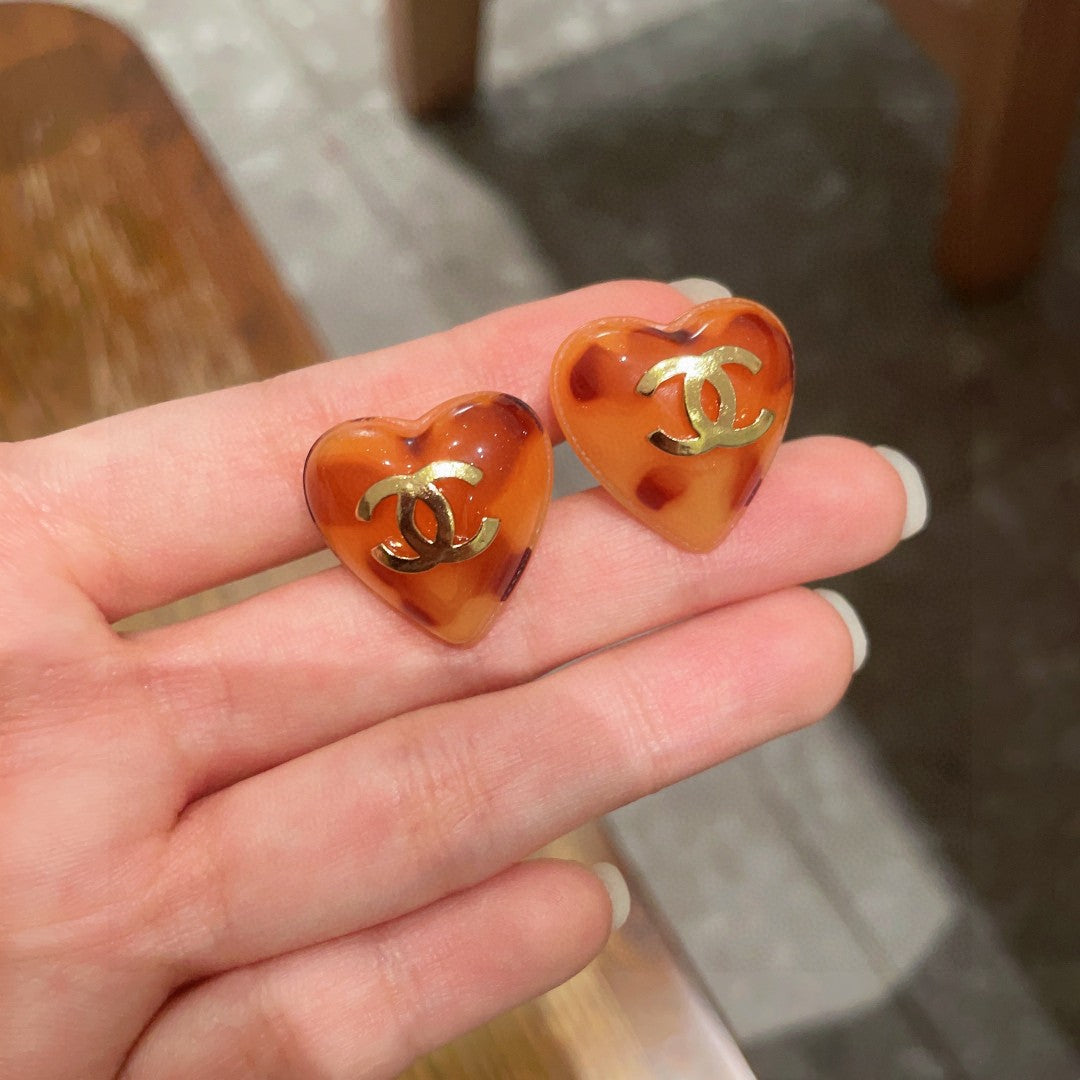Double-C Emblem Stud Earrings in Polished Metal-Tone – Heart Detail side detail