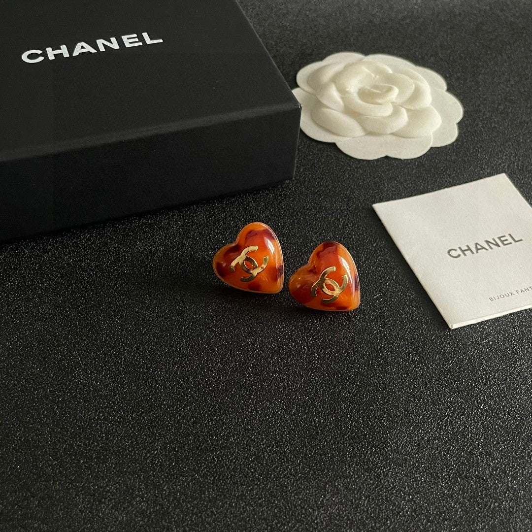 Double-C Emblem Stud Earrings in Polished Metal-Tone – Heart Detail styled product view