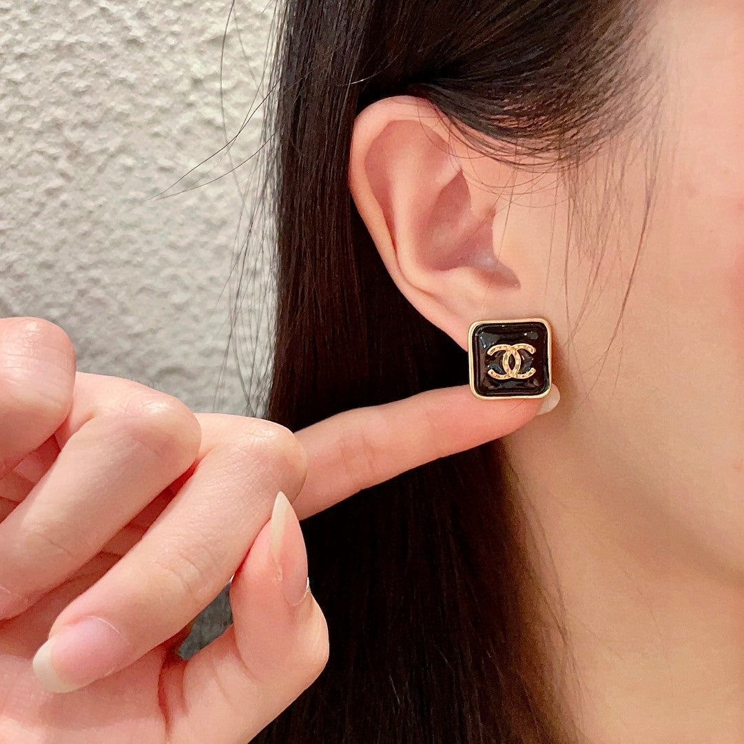 Double-C Emblem Stud Earrings in Polished Metal-Tone – Design 250 front product view
