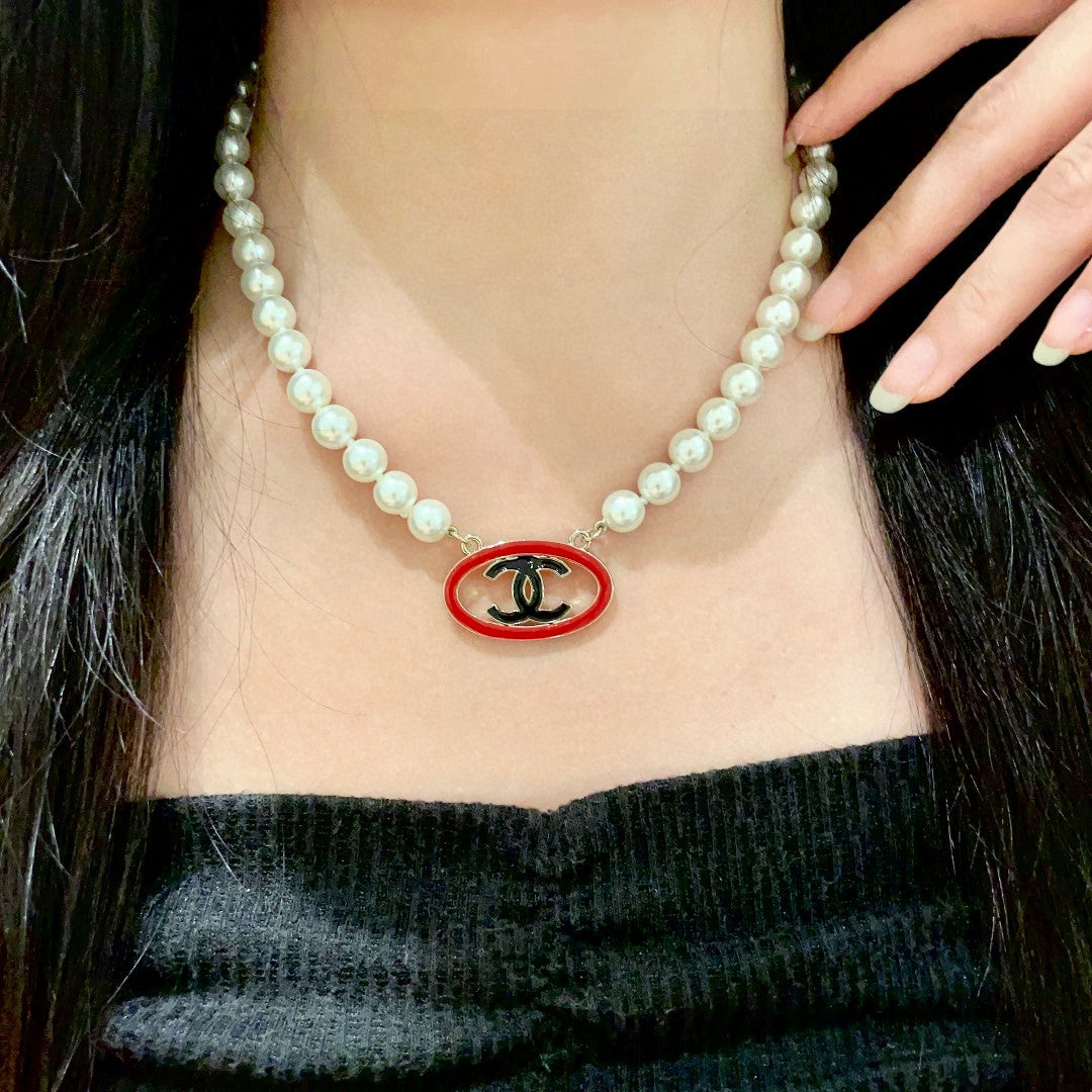 Double-C Emblem Pearl-Detail Pendant Necklace – Pearl Detail – Design 121 detail view