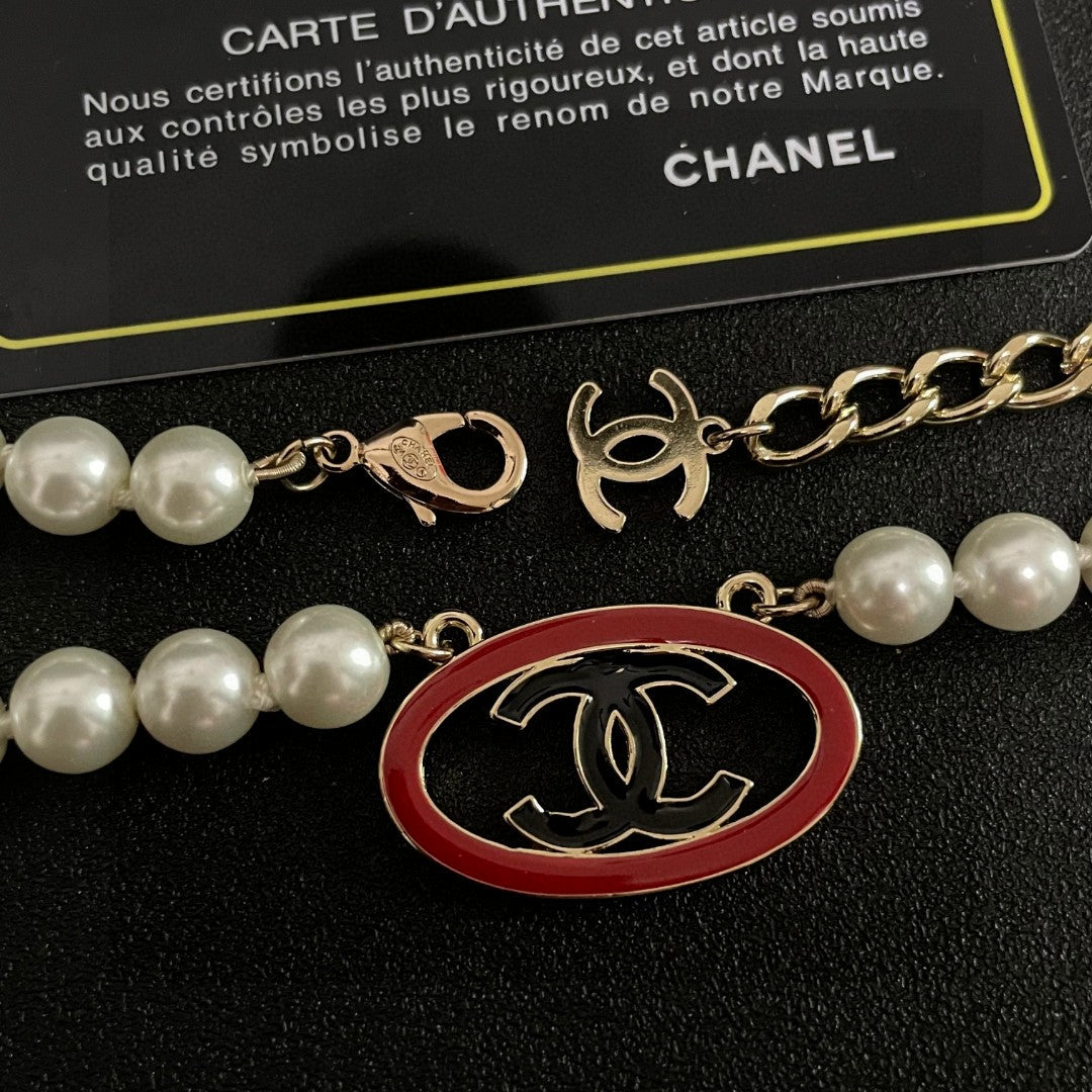 Double-C Emblem Pearl-Detail Pendant Necklace – Pearl Detail – Design 121 detail view