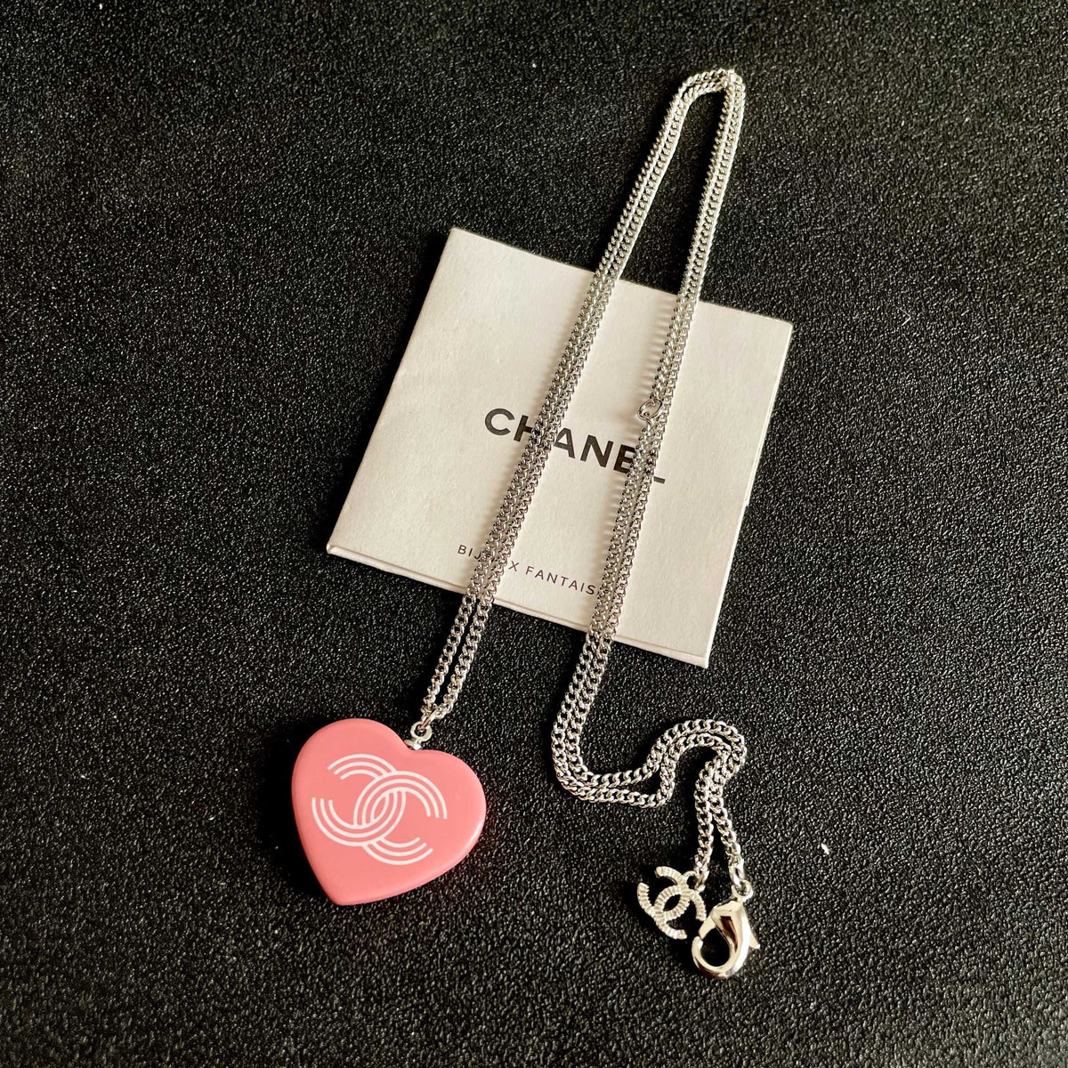 Double-C Emblem Pendant Necklace in Polished Metal-Tone – Heart Detail detail view