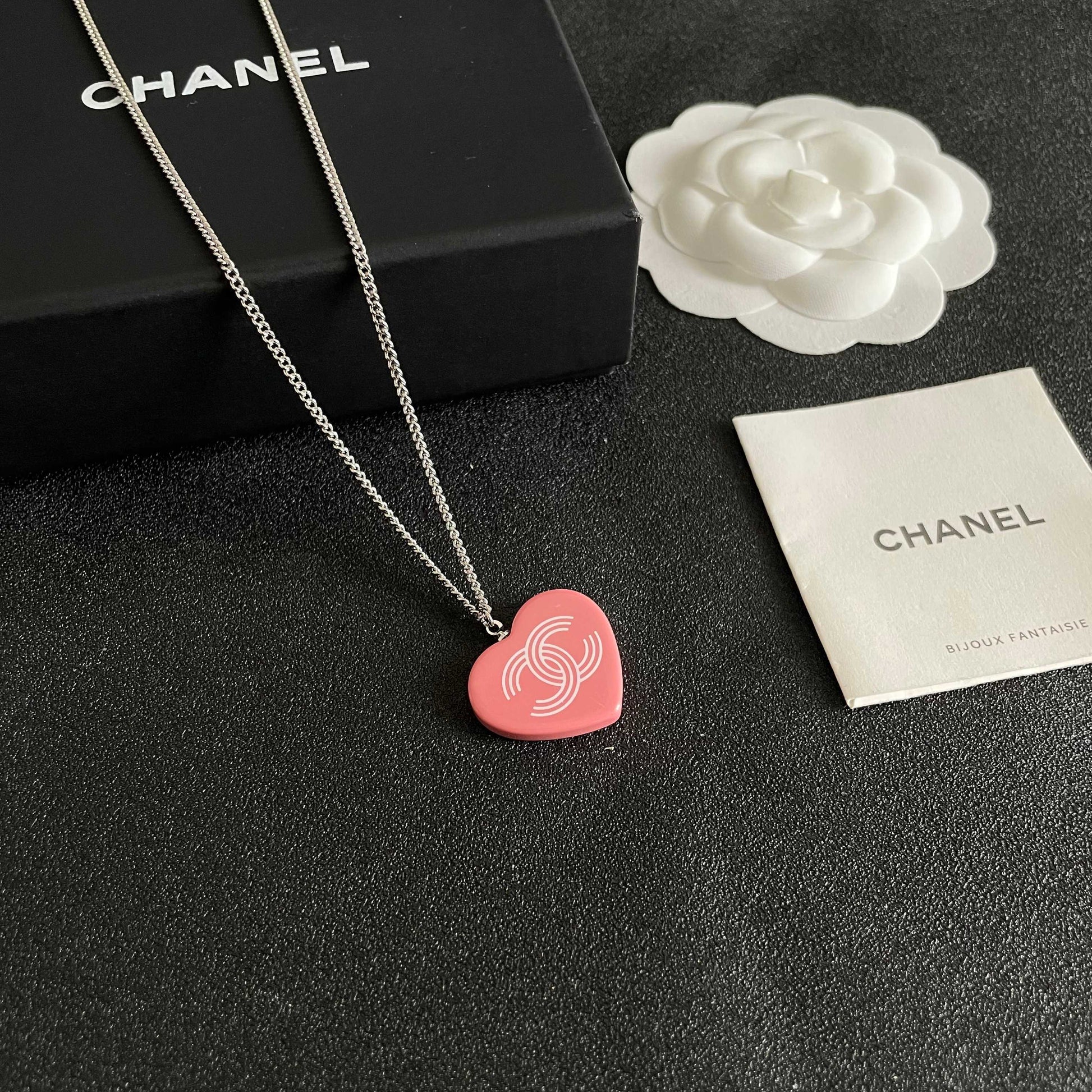 Double-C Emblem Pendant Necklace in Polished Metal-Tone – Heart Detail styled product view