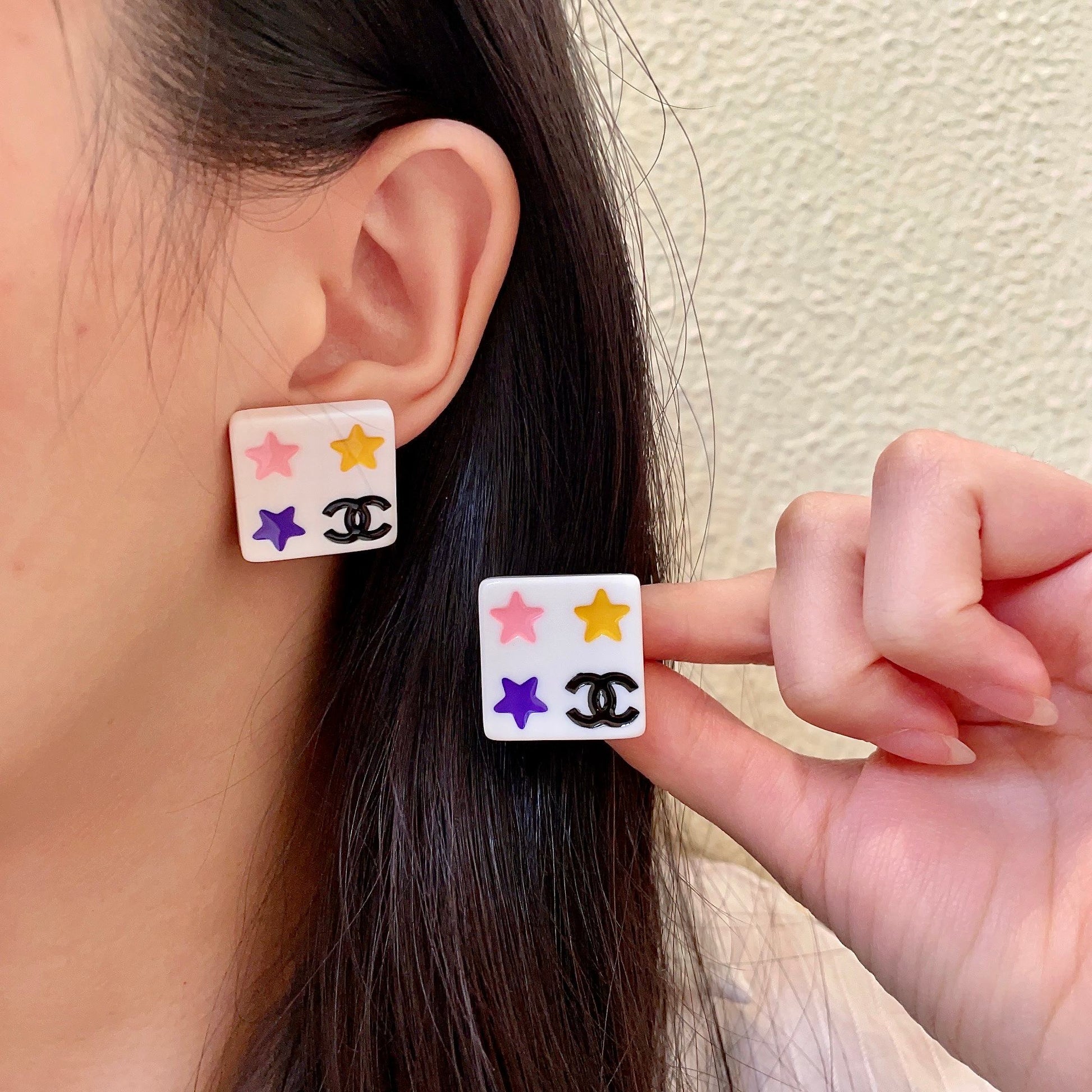 Double-C Emblem Stud Earrings in Polished Metal-Tone – Star Detail main product view