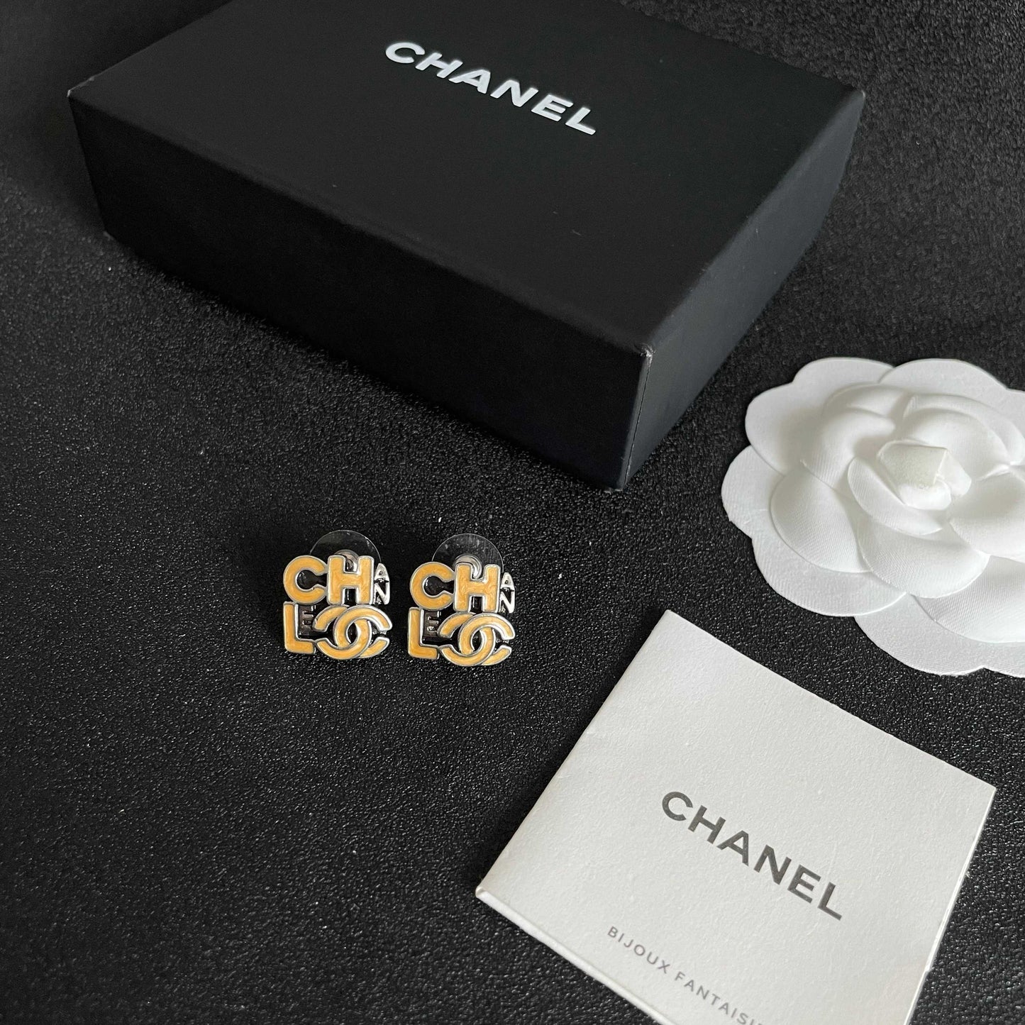 Double-C Emblem Stud Earrings in Polished Metal-Tone – Design 212 close-up detail