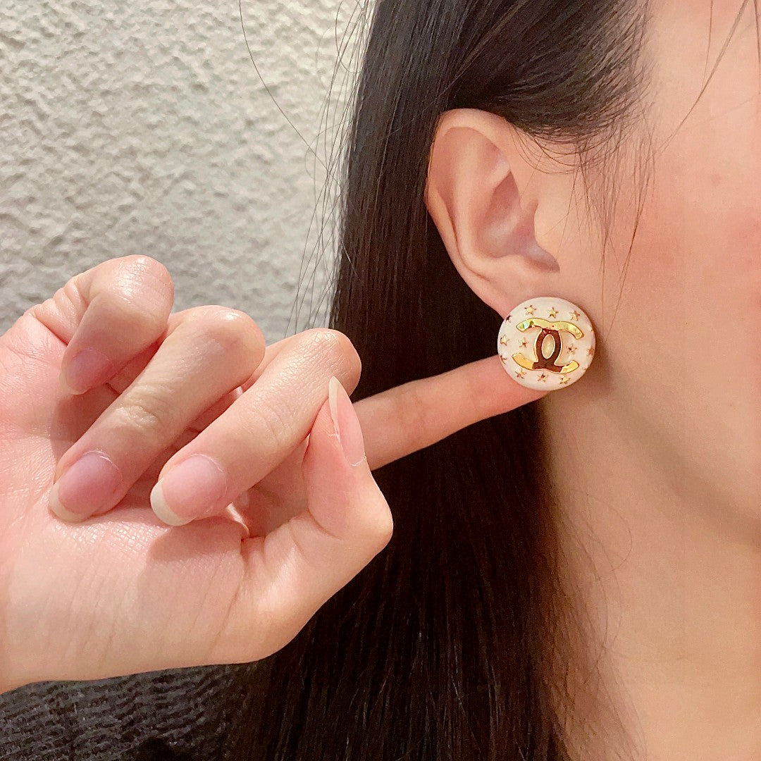 Double-C Emblem Stud Earrings in Polished Metal-Tone – Star Detail – Design 013 front product view