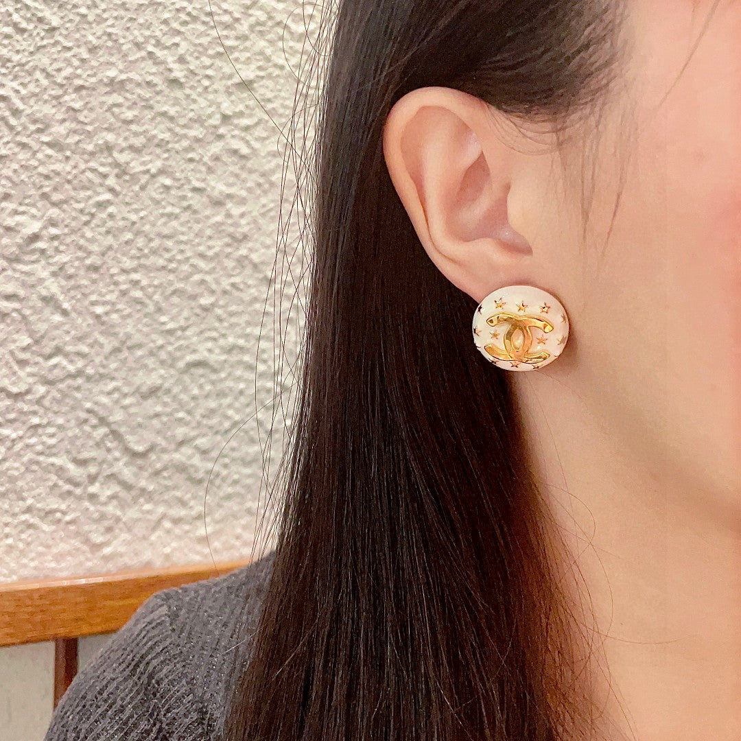 Double-C Emblem Stud Earrings in Polished Metal-Tone – Star Detail – Design 013 detail view