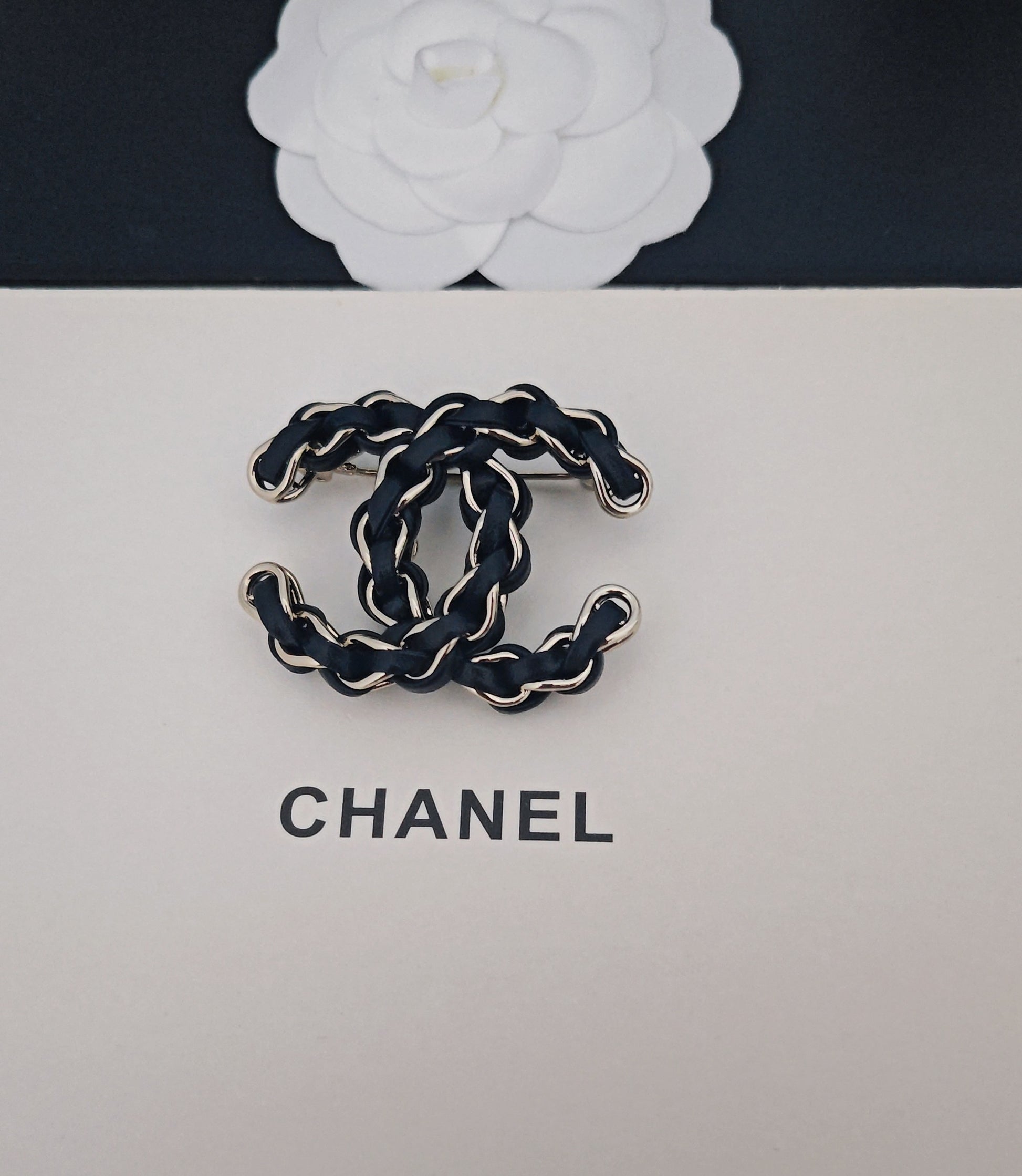 Signature Emblem Brooch in Gold-Tone – Black Detail detail view