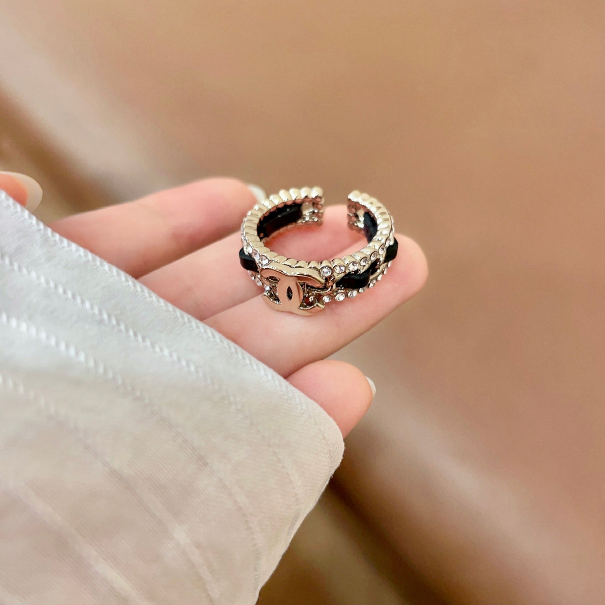 Double-C Emblem Statement Ring in Polished Metal-Tone – White Detail – Design 003 detail view