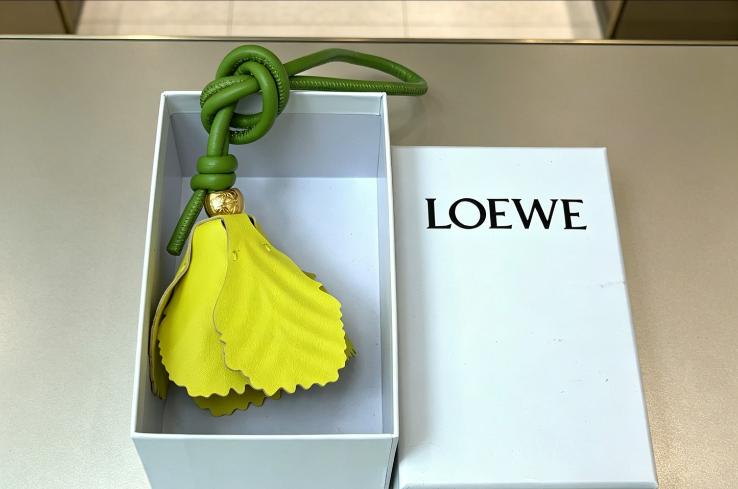 Sculptural Bag Charm in Gold-Tone with Leather Detail – Design 02 main product view