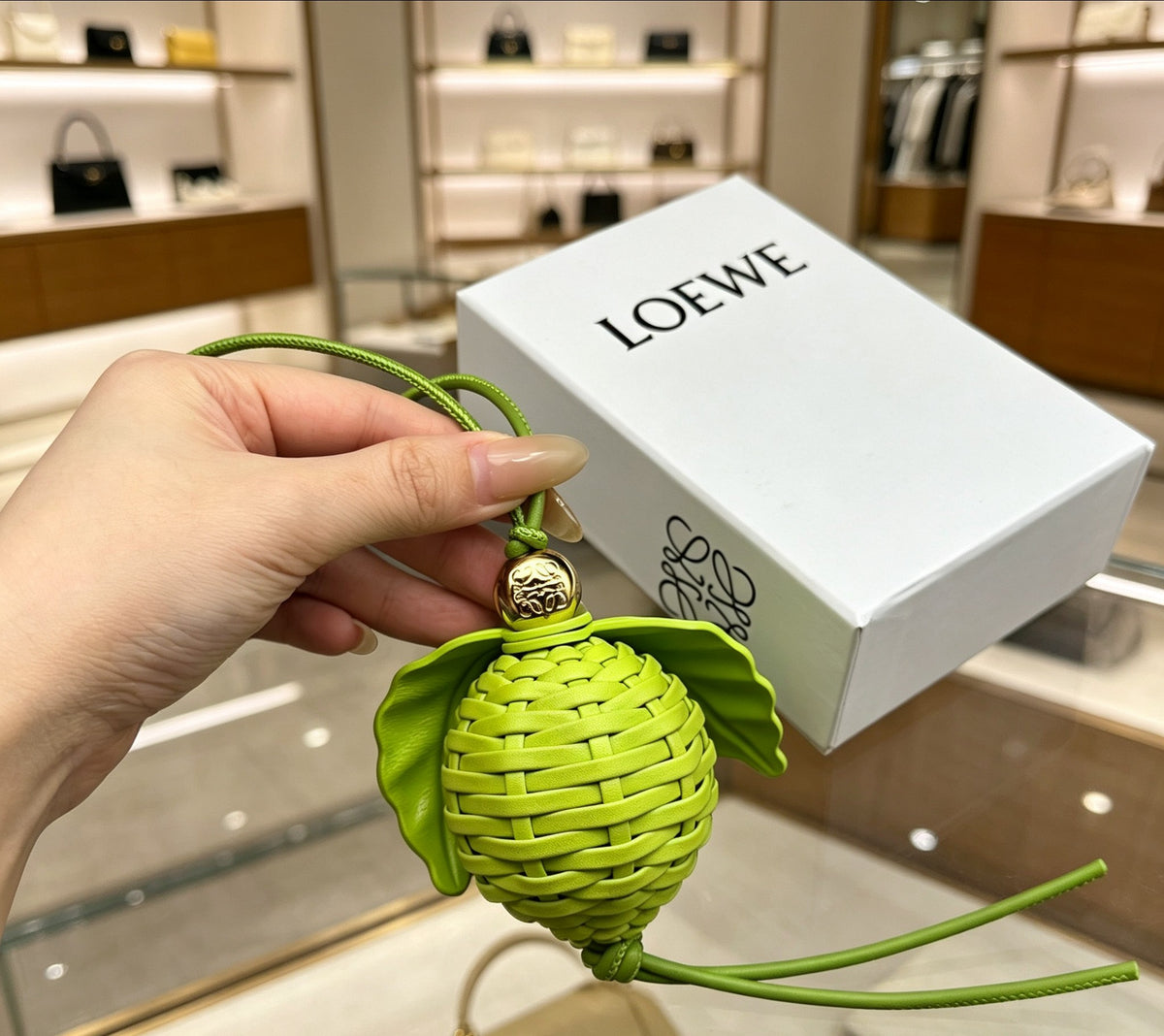 Leaf Motif Bag Charm in Polished Metal-Tone with Leather Detail main product view