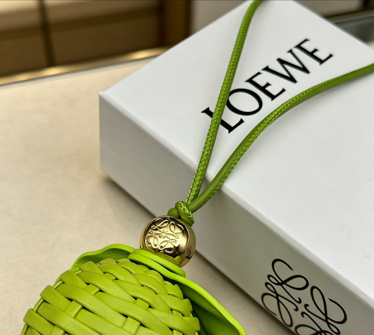 Leaf Motif Bag Charm in Polished Metal-Tone with Leather Detail side detail