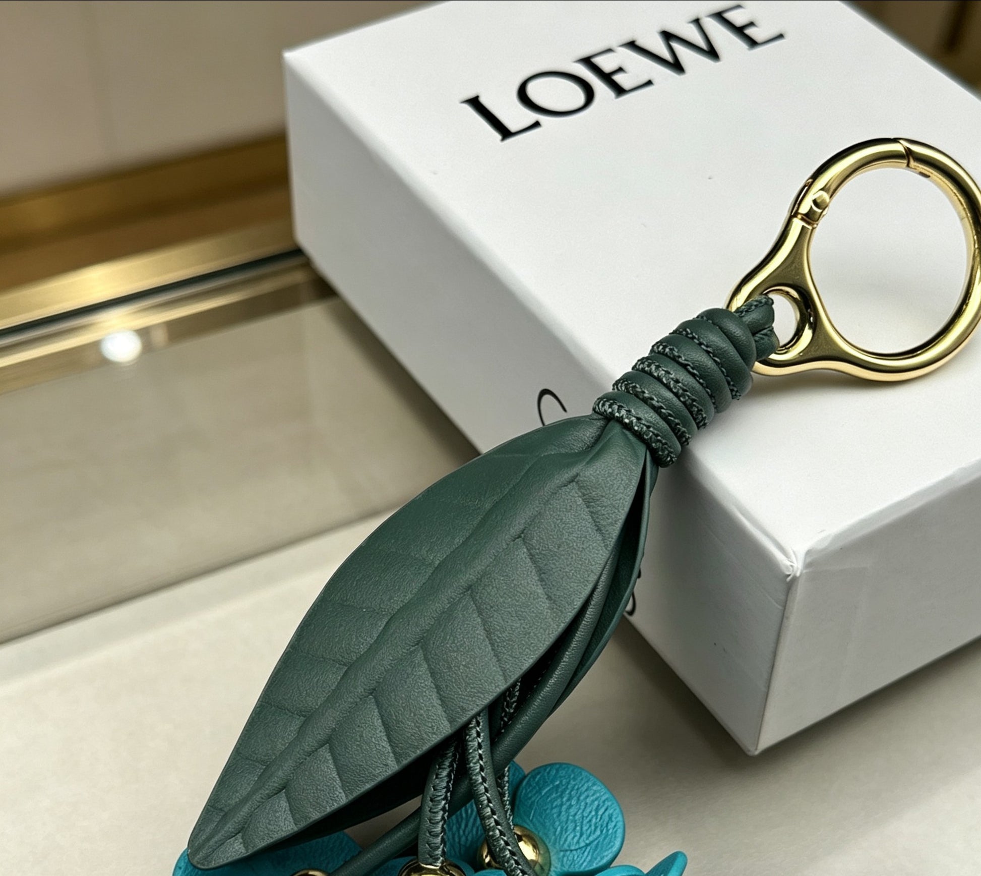 Floral Motif Bag Charm in Polished Metal-Tone with Leather Detail – Design 02 styled view