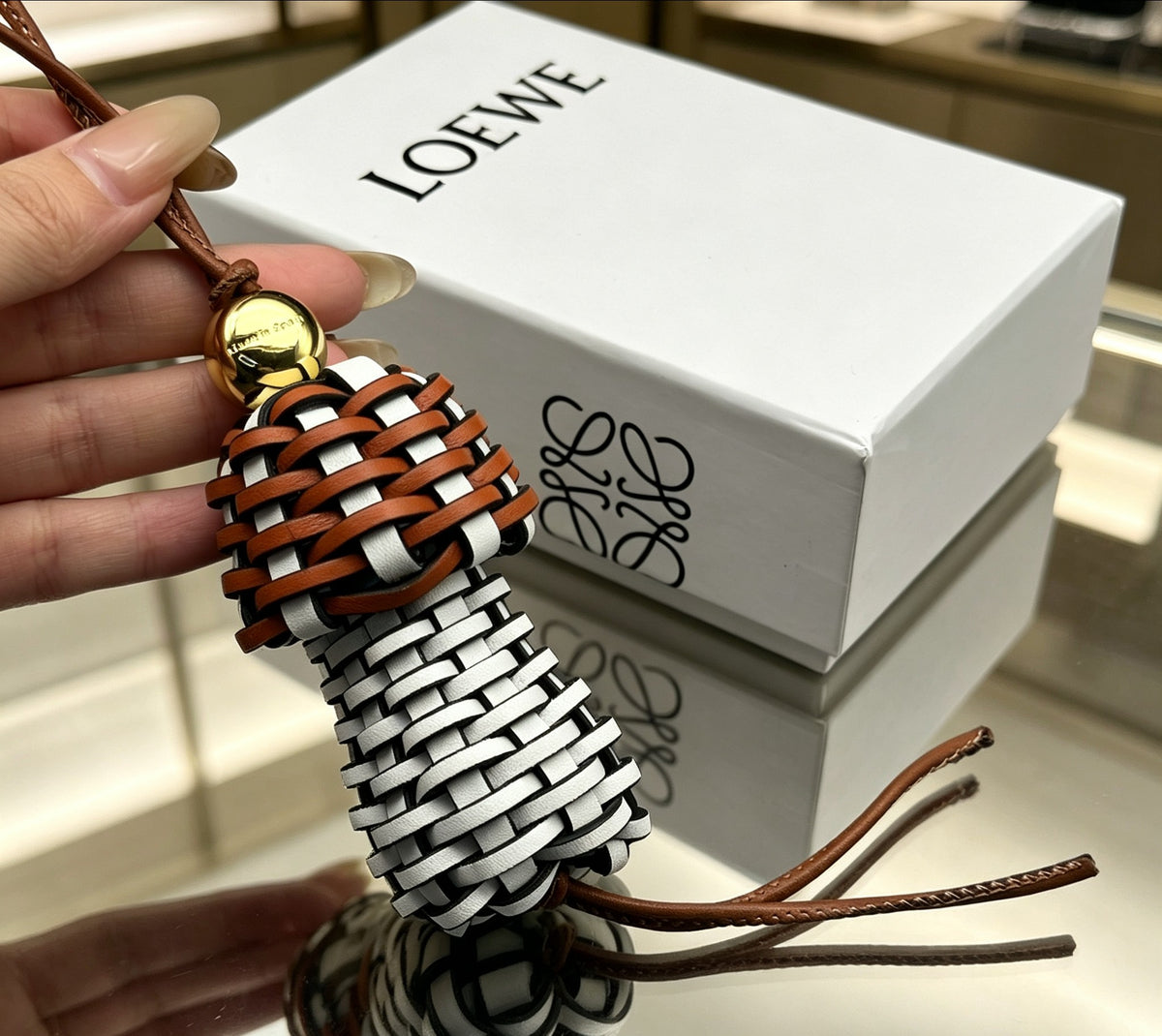 Graphic Emblem Bag Charm in Polished Metal-Tone with Leather Detail – Design 01 detail view