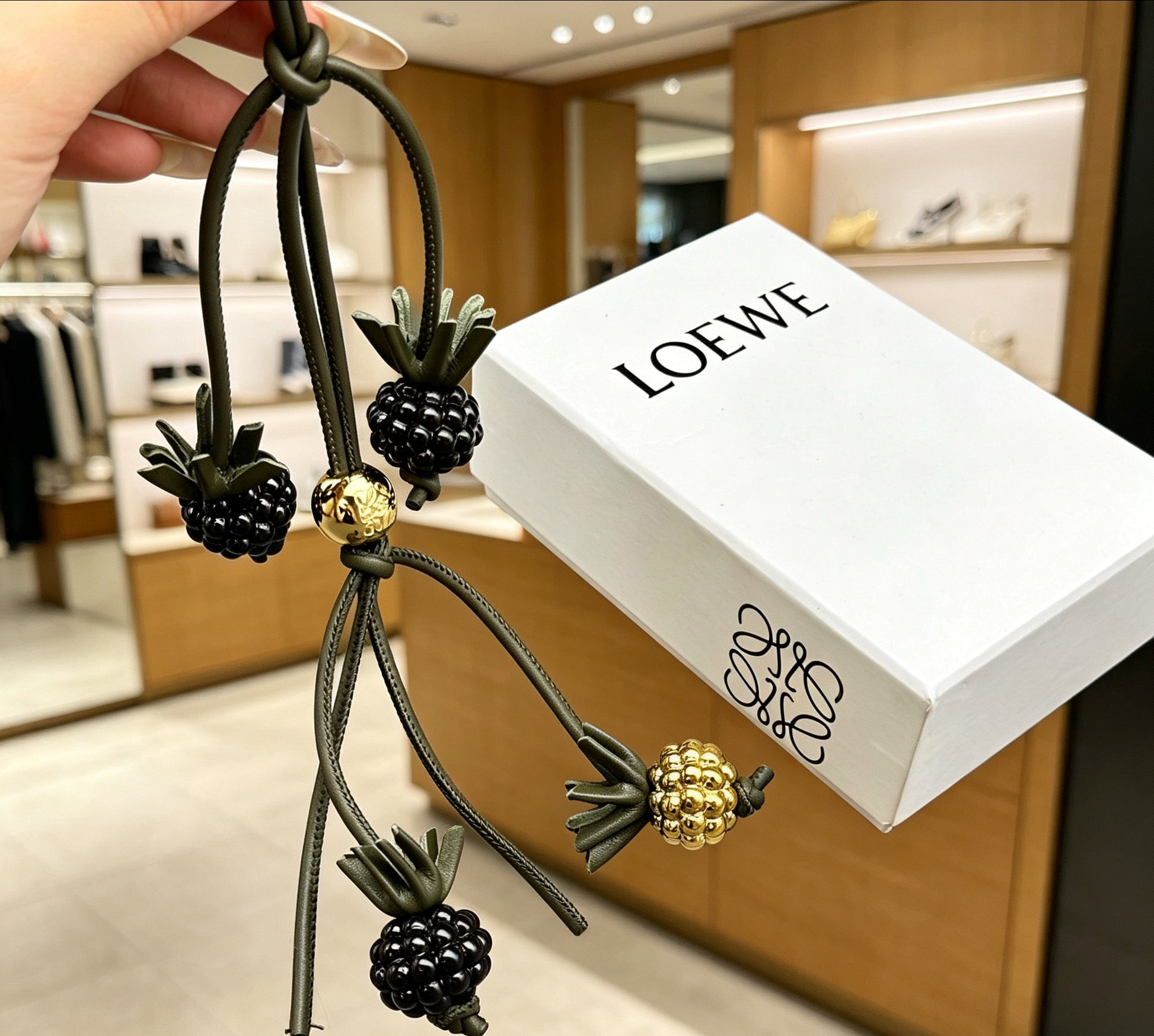 Graphic Emblem Bag Charm in Polished Metal-Tone with Leather Detail – Design 02 side detail