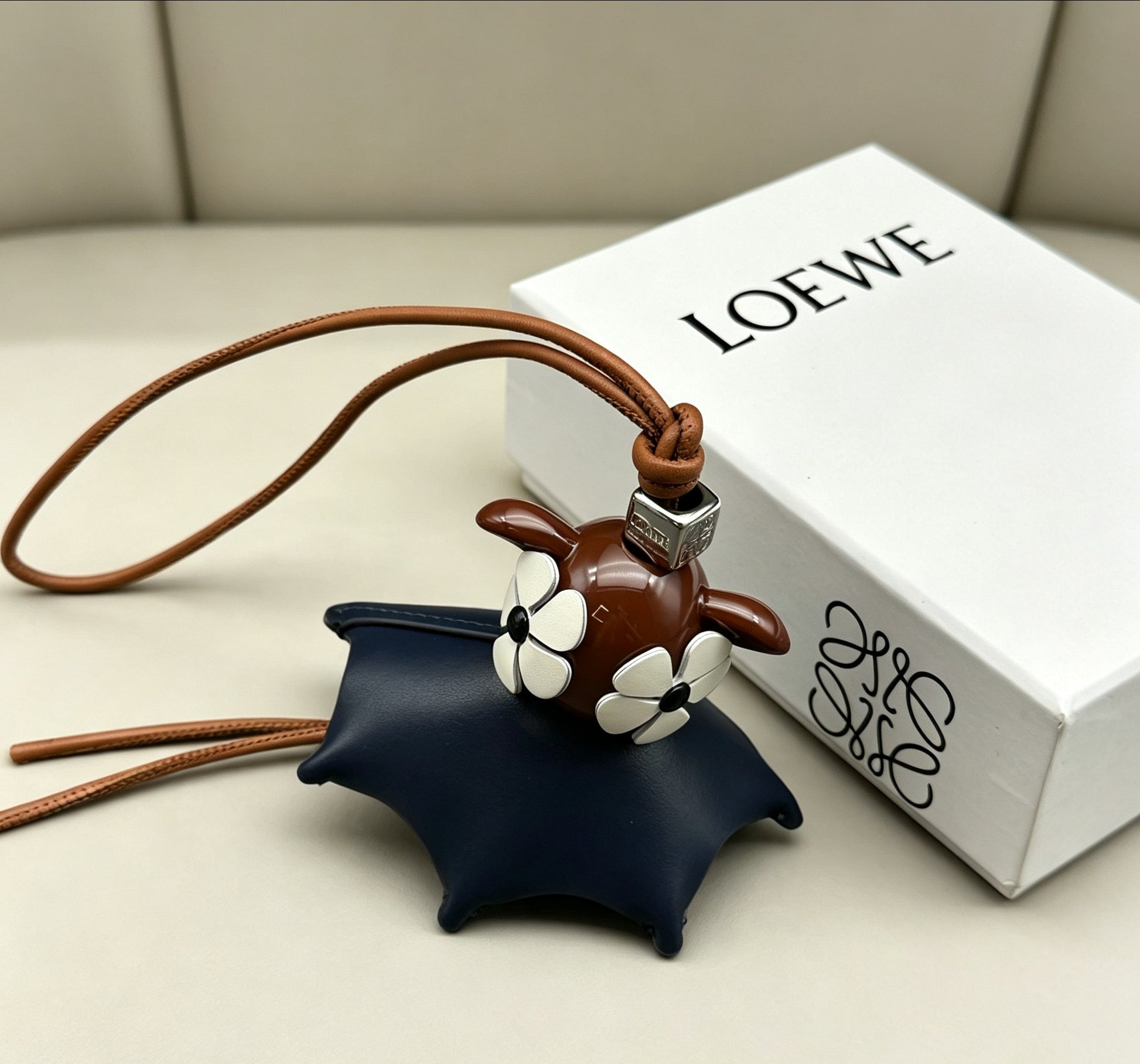 Floral Motif Bag Charm in Polished Metal-Tone with Leather Detail – Design 03 front view