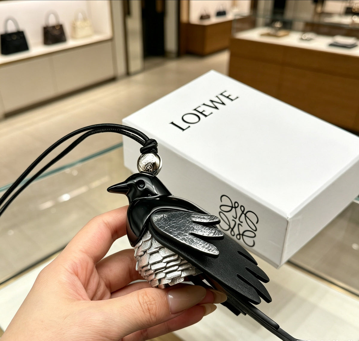 Bird Motif Bag Charm in Silver-Tone with Leather Detail front view