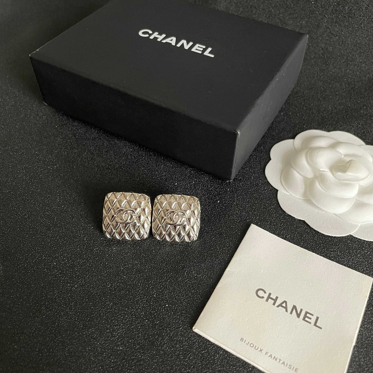 Double-C Emblem Stud Earrings in Polished Metal-Tone – Design 077 close-up detail
