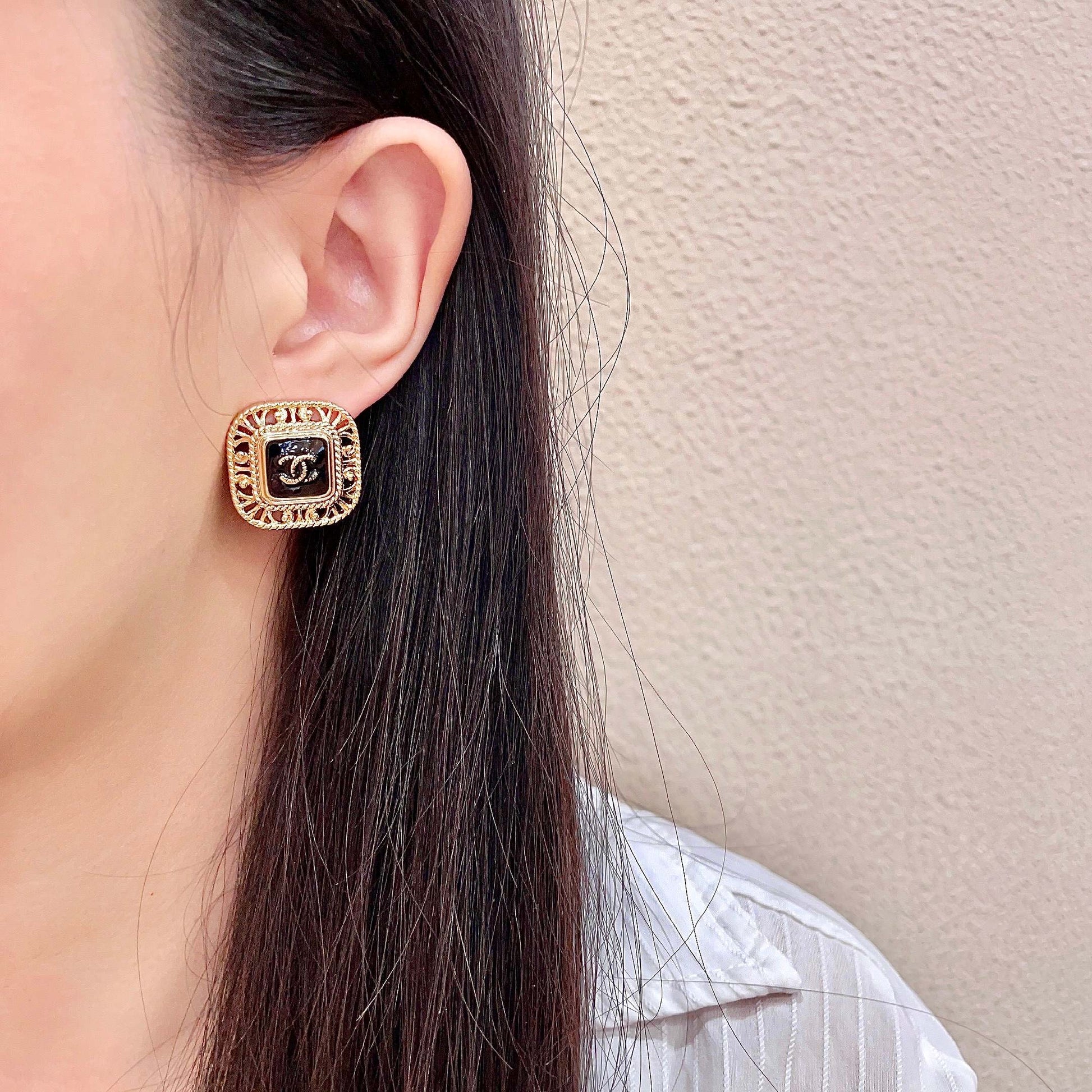Double-C Emblem Stud Earrings in Polished Metal-Tone – Design 140 detail view