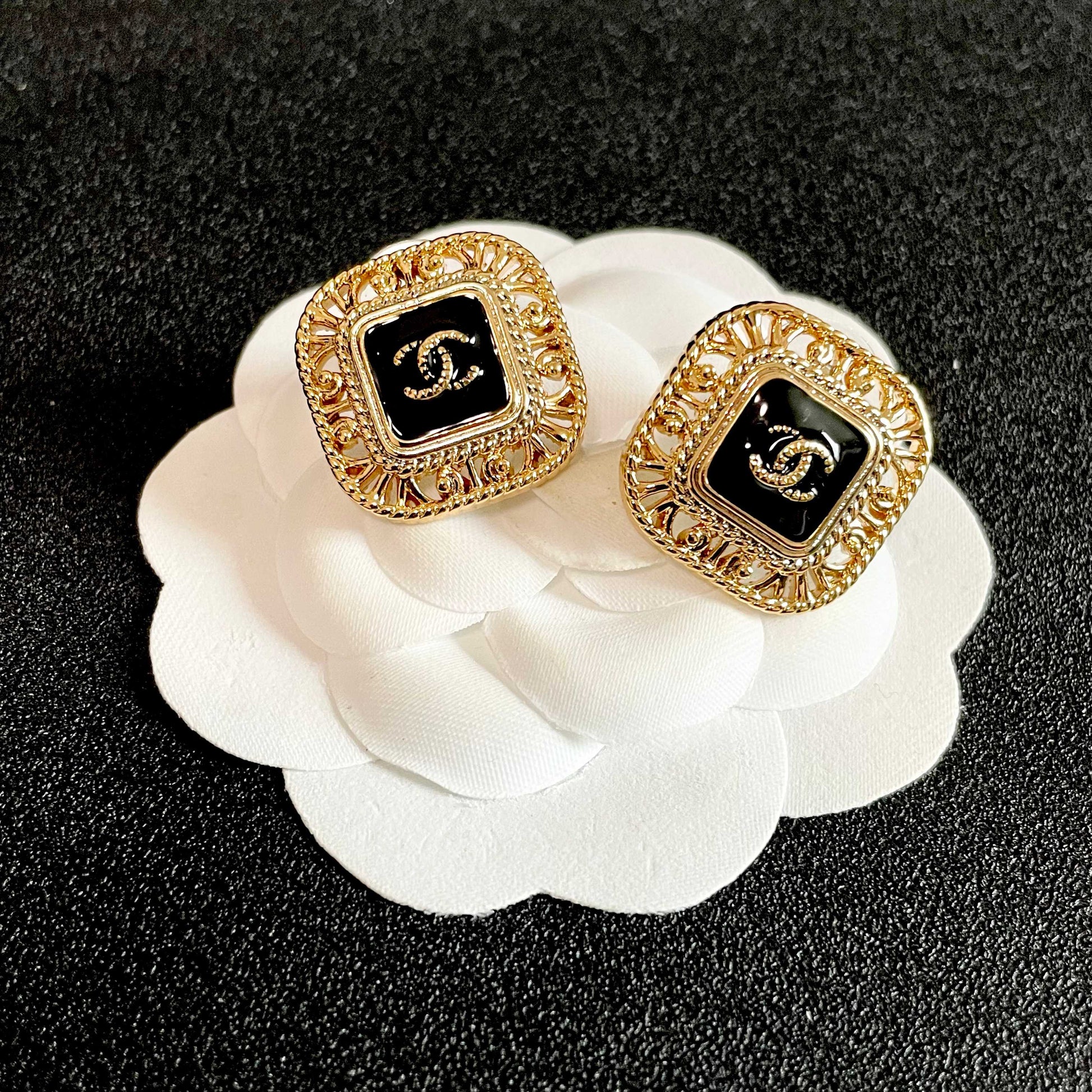 Double-C Emblem Stud Earrings in Polished Metal-Tone – Design 140 front product view
