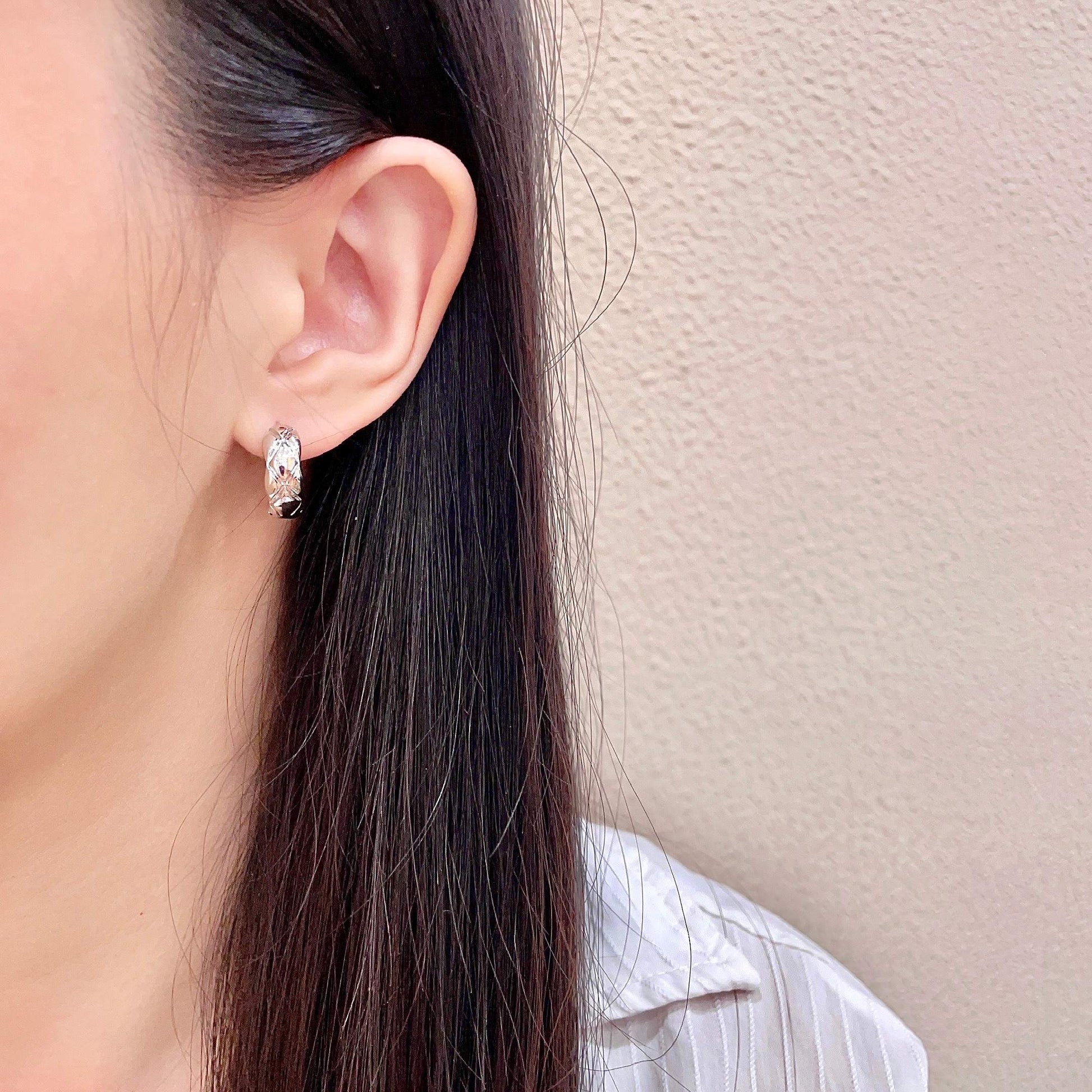 Double-C Emblem Stud Earrings in Polished Metal-Tone – Design 096 detail view