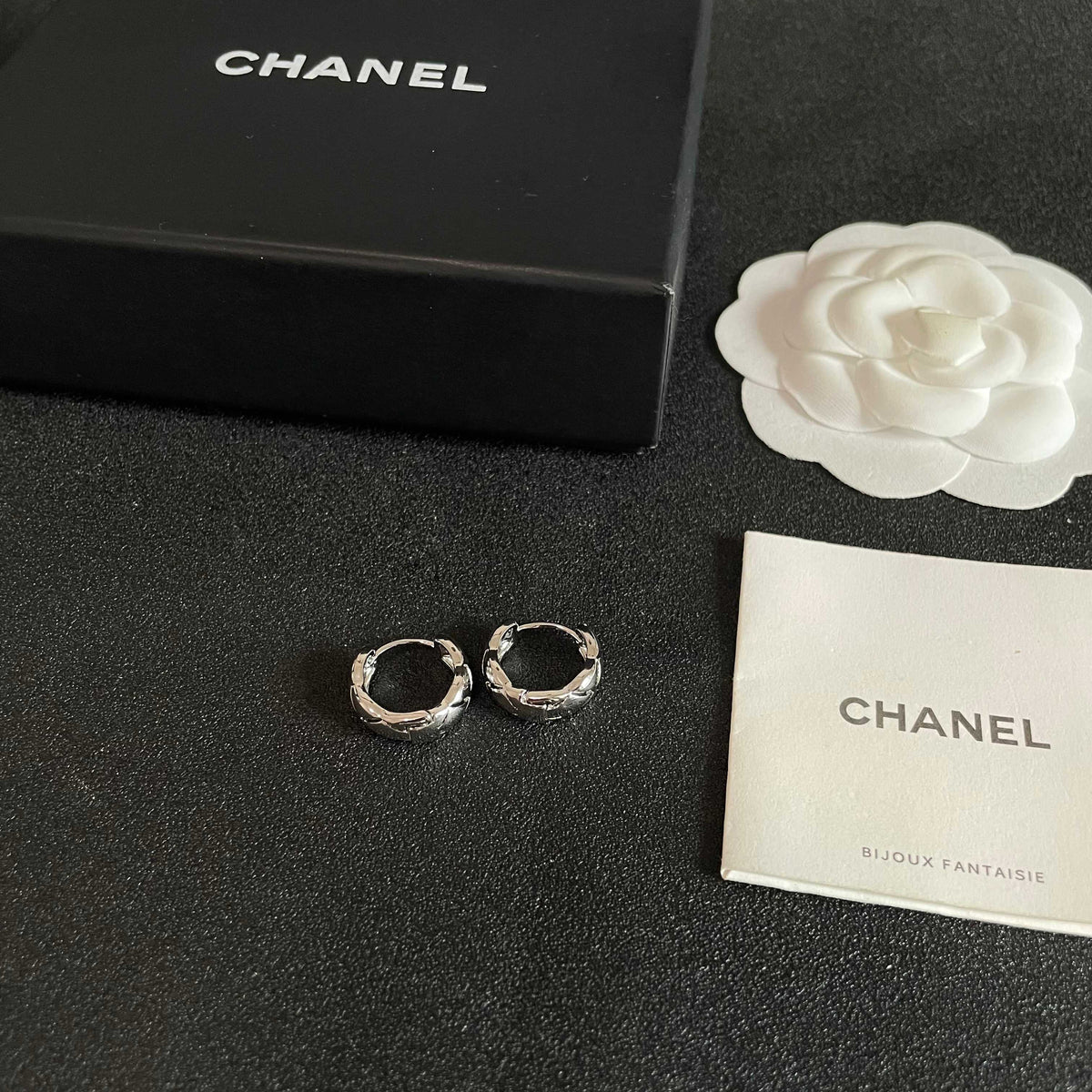 Double-C Emblem Stud Earrings in Polished Metal-Tone – Design 096 close-up detail