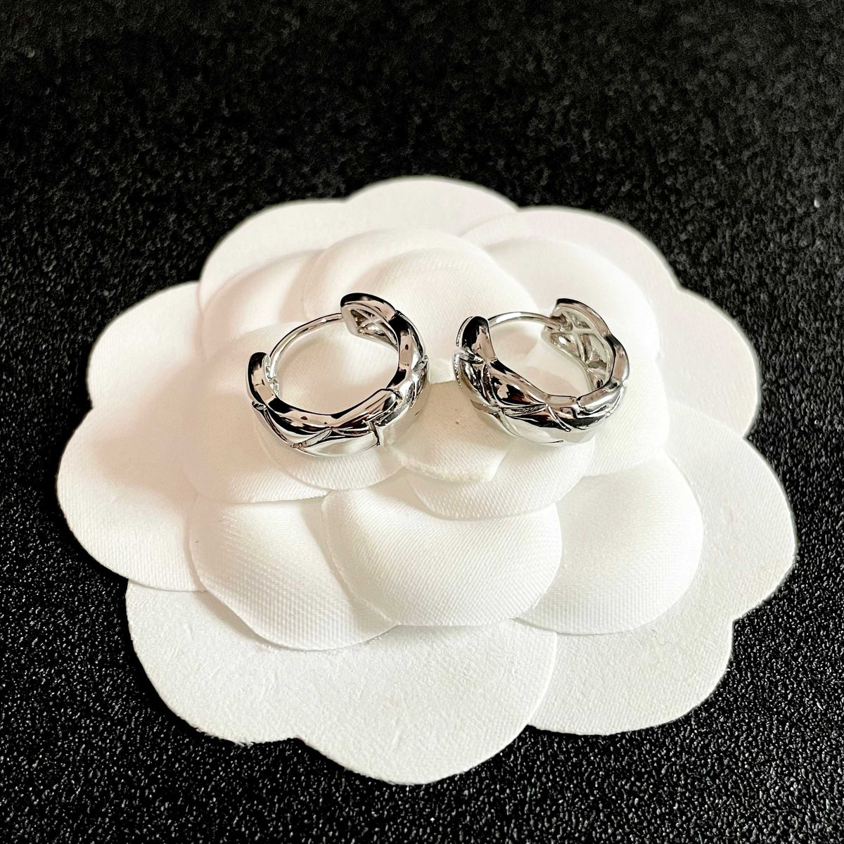 Double-C Emblem Stud Earrings in Polished Metal-Tone – Design 096 front product view