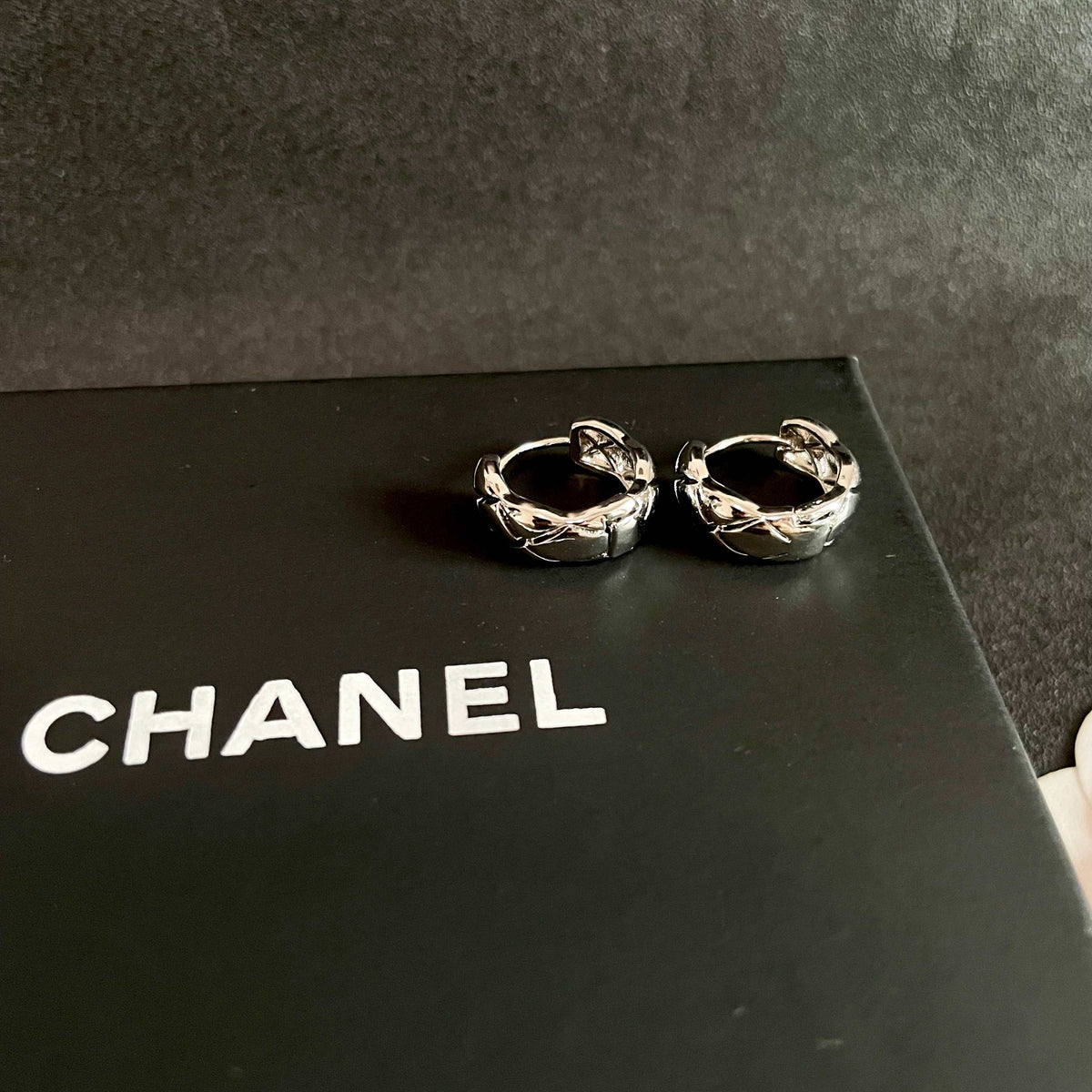Double-C Emblem Stud Earrings in Polished Metal-Tone – Design 096 detail view