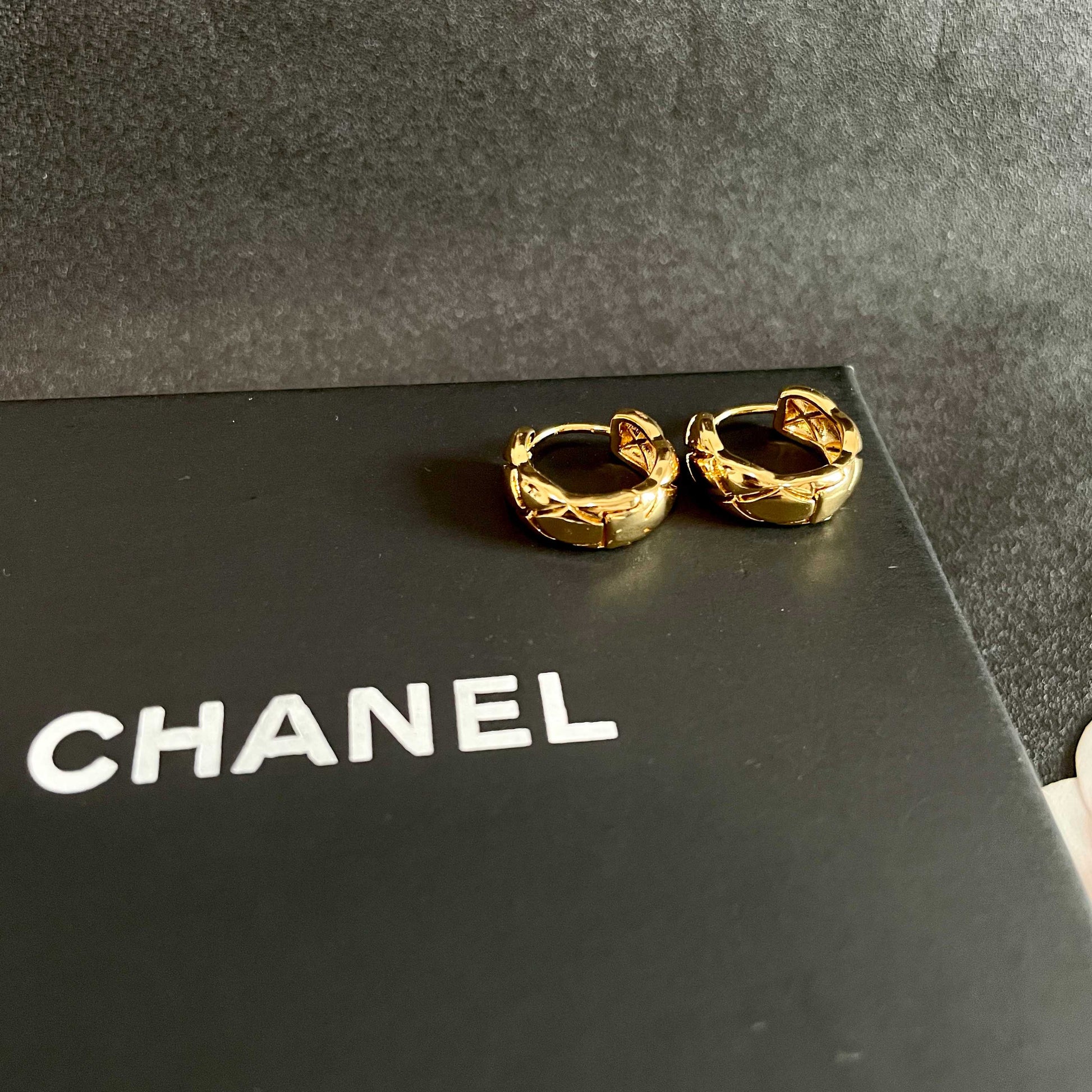 Double-C Emblem Stud Earrings in Polished Metal-Tone – Design 095 detail view