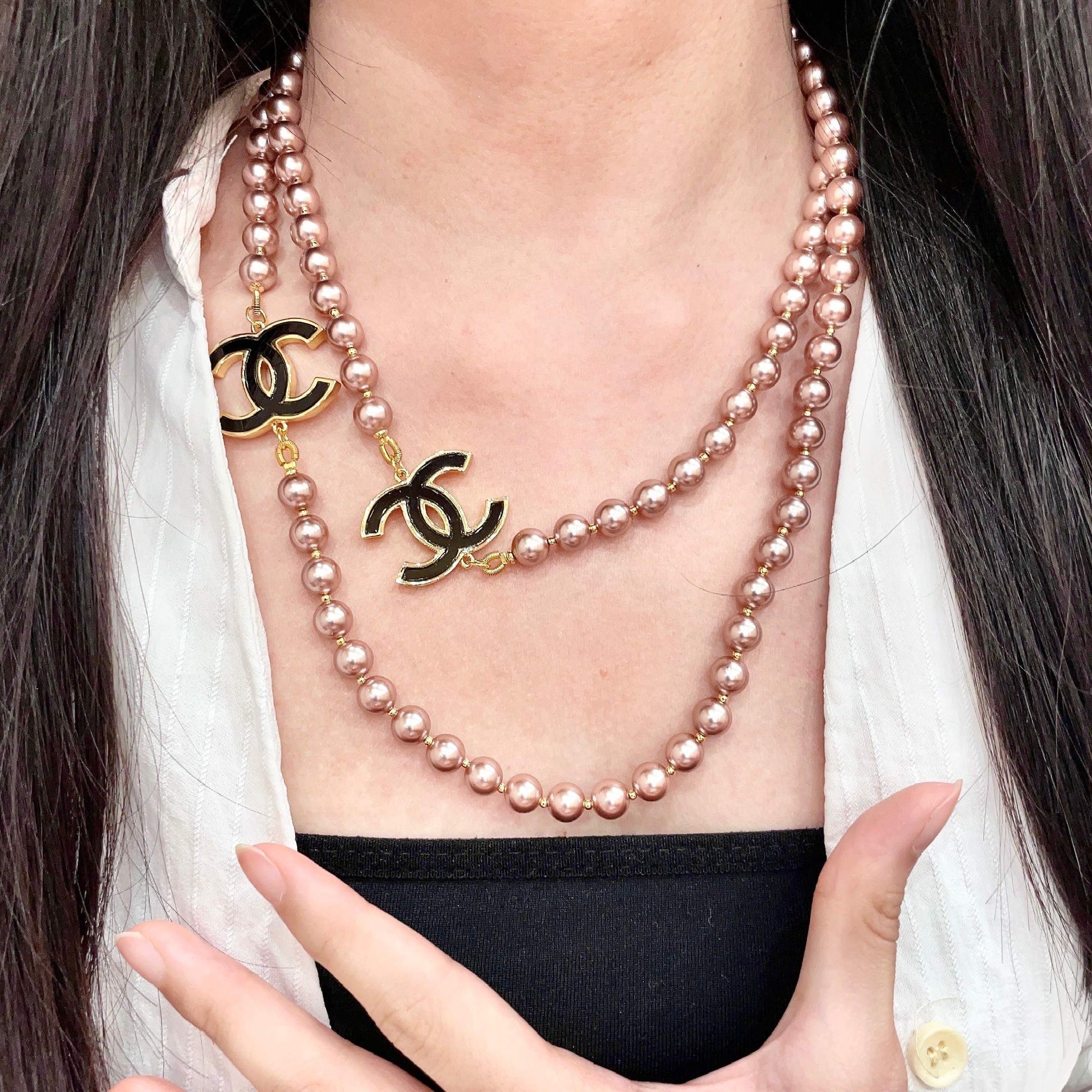 Double-C Emblem Jewelry Accessory in Gold-Tone – Pearl Detail front product view