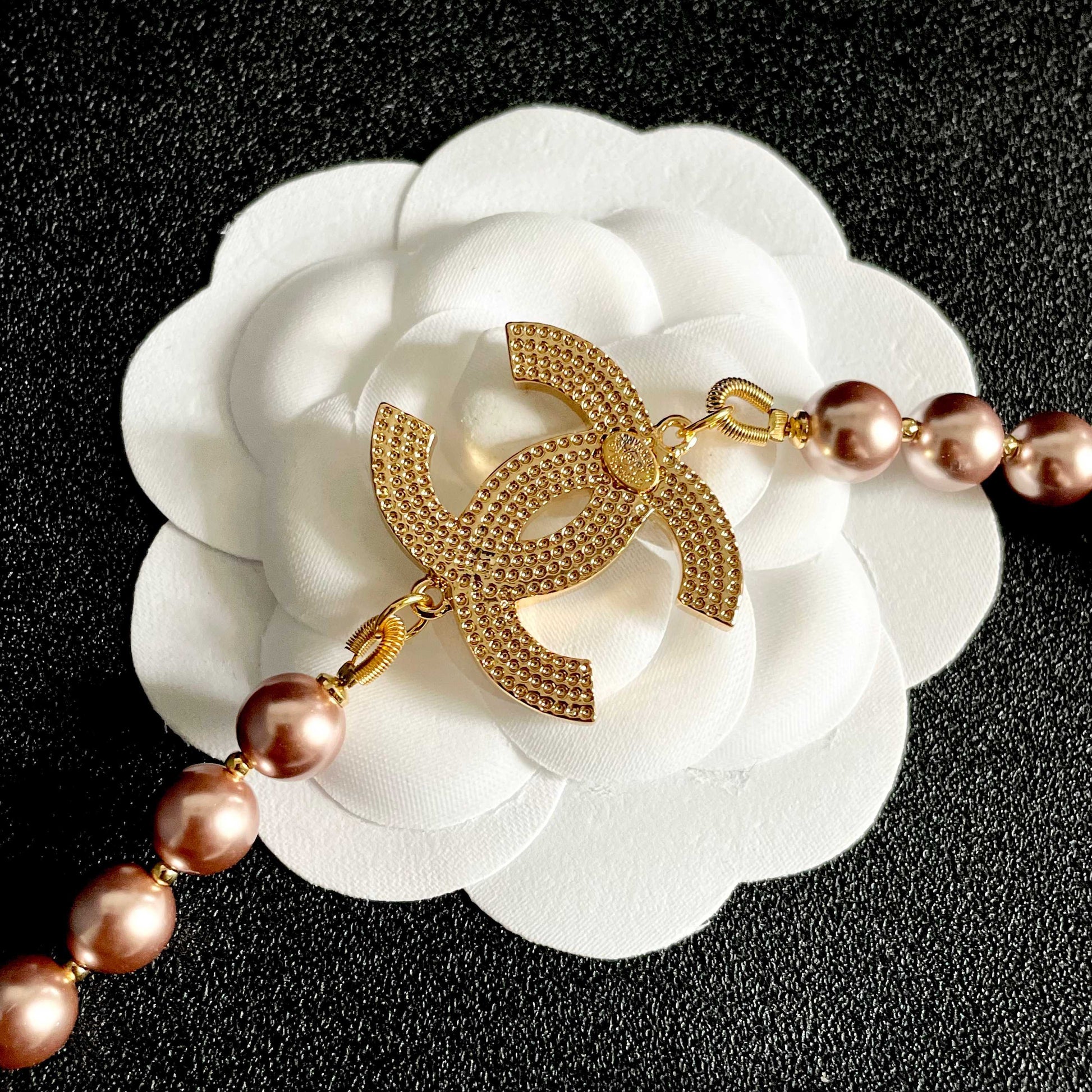 Double-C Emblem Jewelry Accessory in Gold-Tone – Pearl Detail front product view
