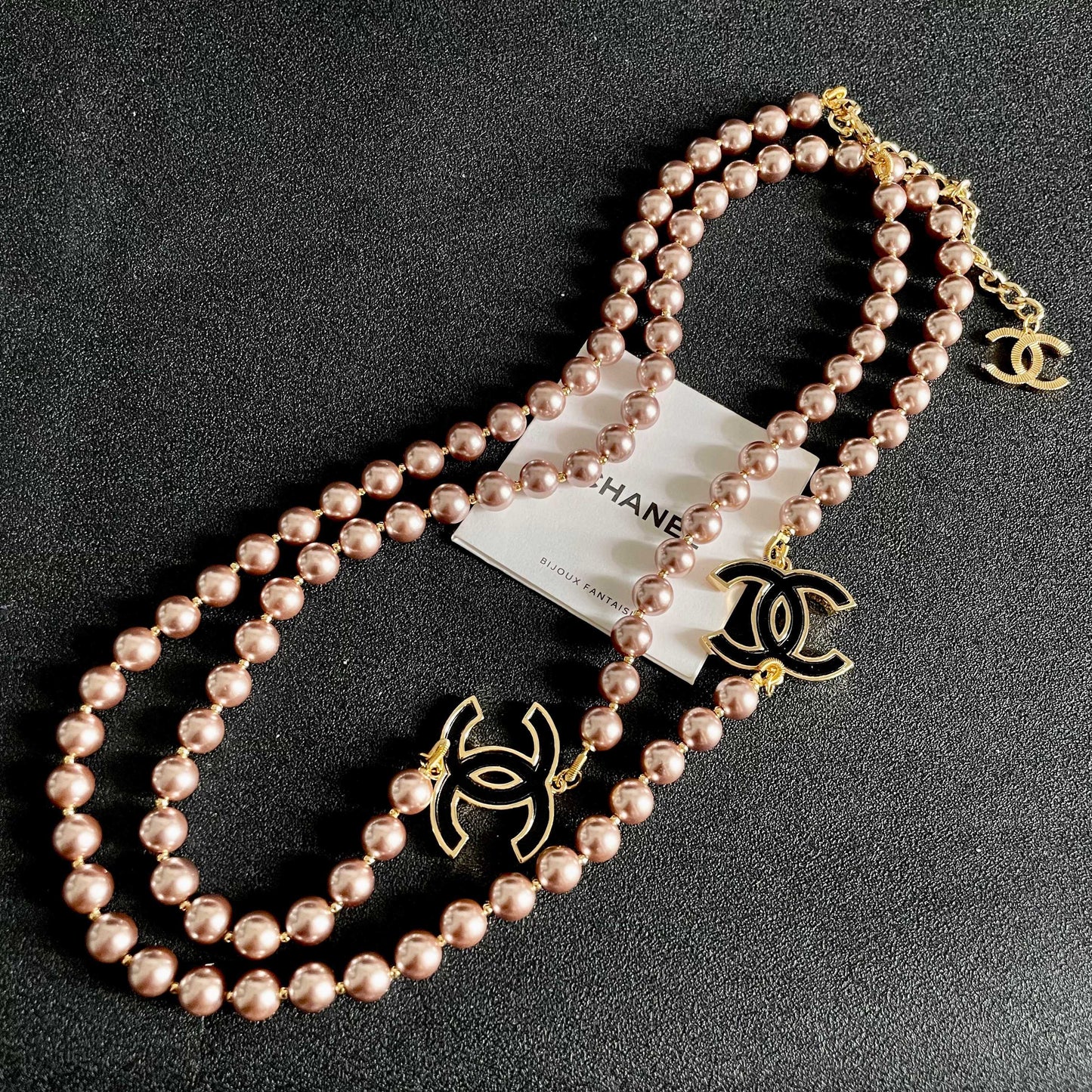 Double-C Emblem Jewelry Accessory in Gold-Tone – Pearl Detail detail view