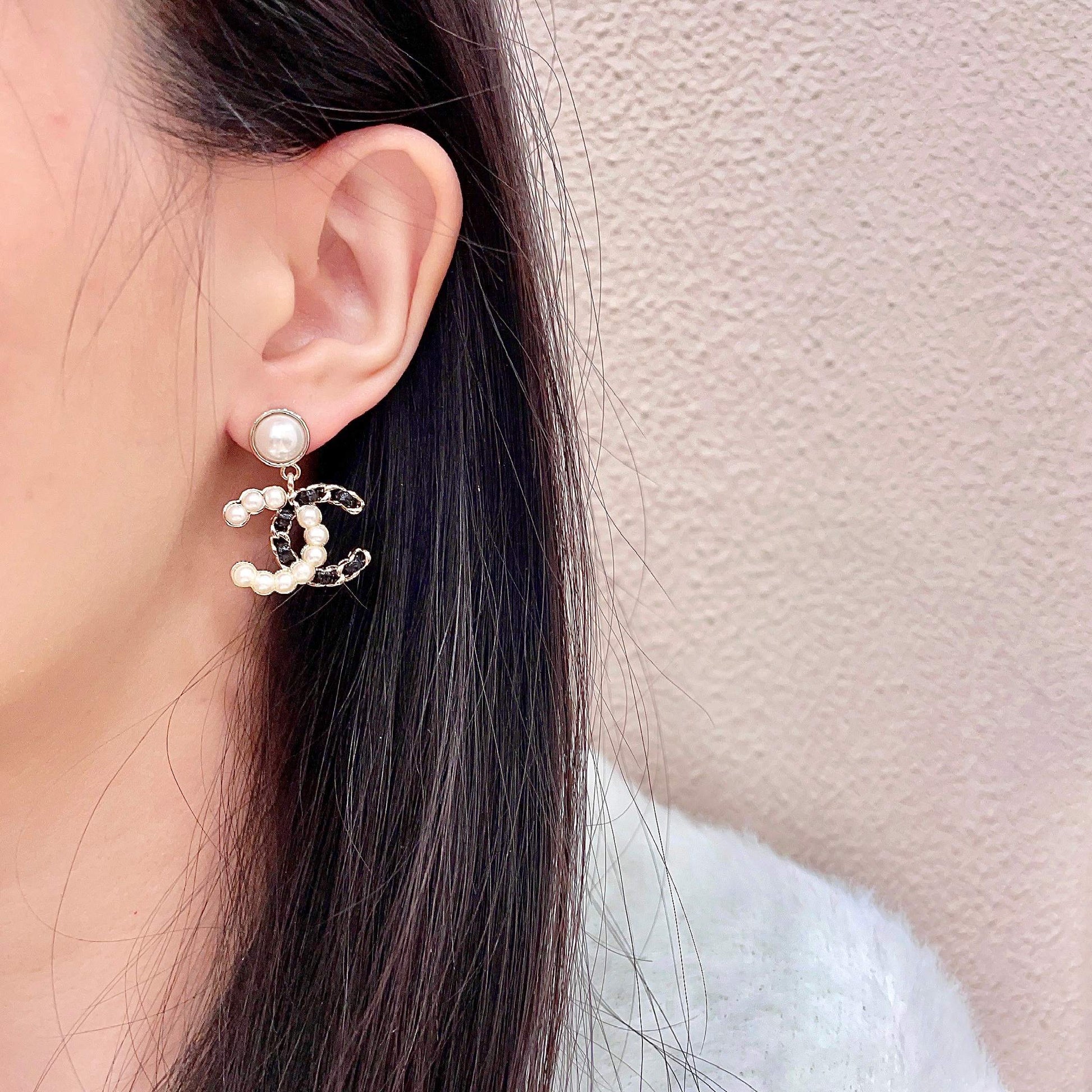 Double-C Emblem Stud Earrings in Polished Metal-Tone – Design 094 detail view