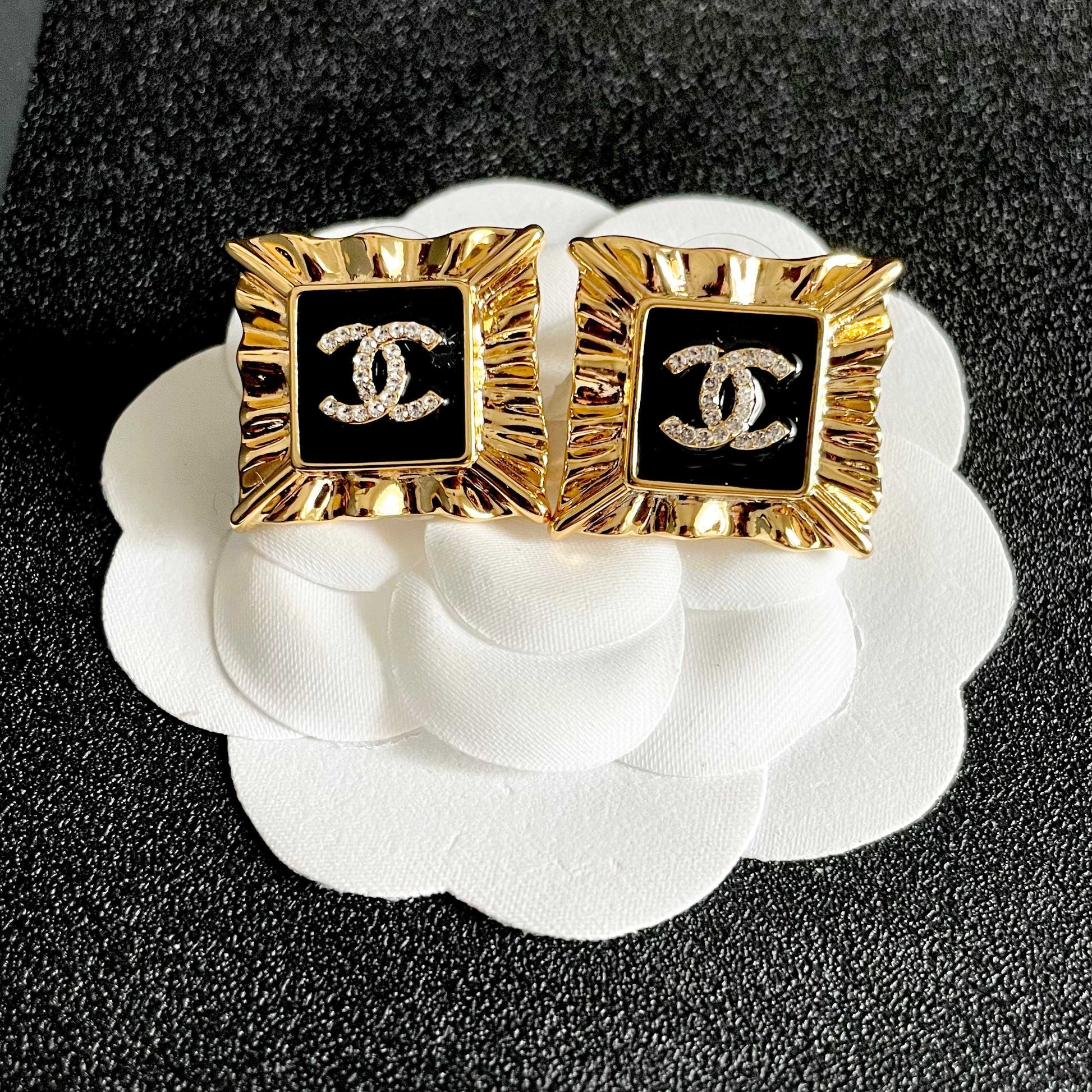 Double-C Emblem Stud Earrings in Polished Metal-Tone – Design 086 front product view